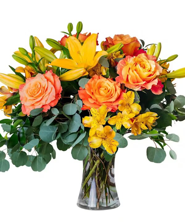 FANCY FREE - Make them what to dance footloose and &quot;Fancy Free&quot;. Free Spirit roses and yellow lilies are bright and fun.  