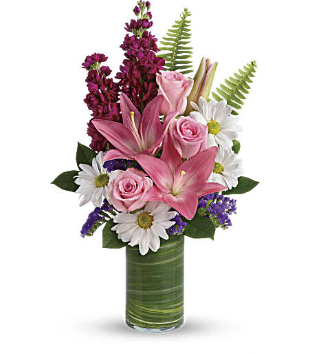 Playful Daisy Bouquet Playful Daisy Bouquet - Bright white daisies and pink roses dance with happy pink lilies and fabulous fuchsia stock in this playful bouquet! Wrapped with a ti leaf in a modern cylinder vase, it's a joyful gift for any occasion.