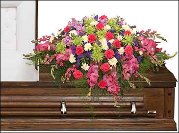 ETERNAL BEAUTY CASKET SPRAY  Funeral Flowers - Lovely spring flowers in uplifting colors fill this lovely casket spray.