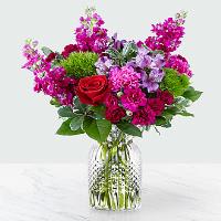 FALLING FOR YOU BOUQUET FALLING FOR YOU BOUQUET - Brighten up your Valentine's Day with a bouquet that has a message of love bursting from the vase. Comprised of an array of red roses, green trick dianthus, fuchsia stock and purple alstroemeria, Our Falling for You Bouquet is full of romantic blooms that will captivate your special someone. This arrangement is artfully complete with violet mini carnations, fuchsia standard carnations, variegated pittosporum, and luscious salal, making it a bouquet that shines with effortless beauty. GOOD bouquet is approx. 16"H x 14"W. BETTER bouquet is approx. 17"H x 15"W. BEST bouquet is approx. 18"H x 17"W.