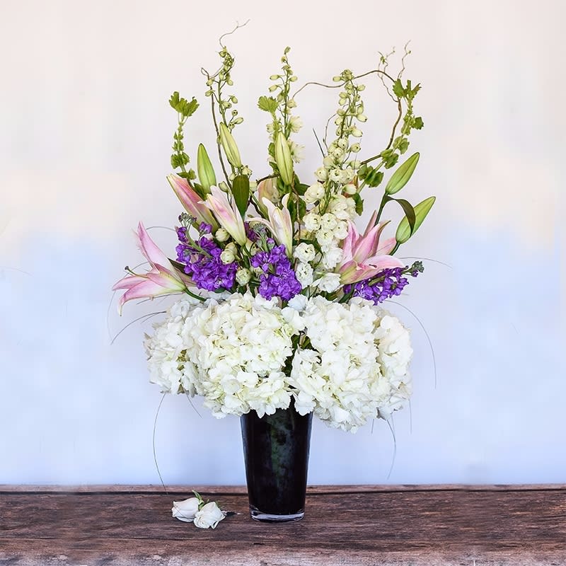 Elegant Elegant - This lush, impressive arrangement is designed with soft, calming pastels.