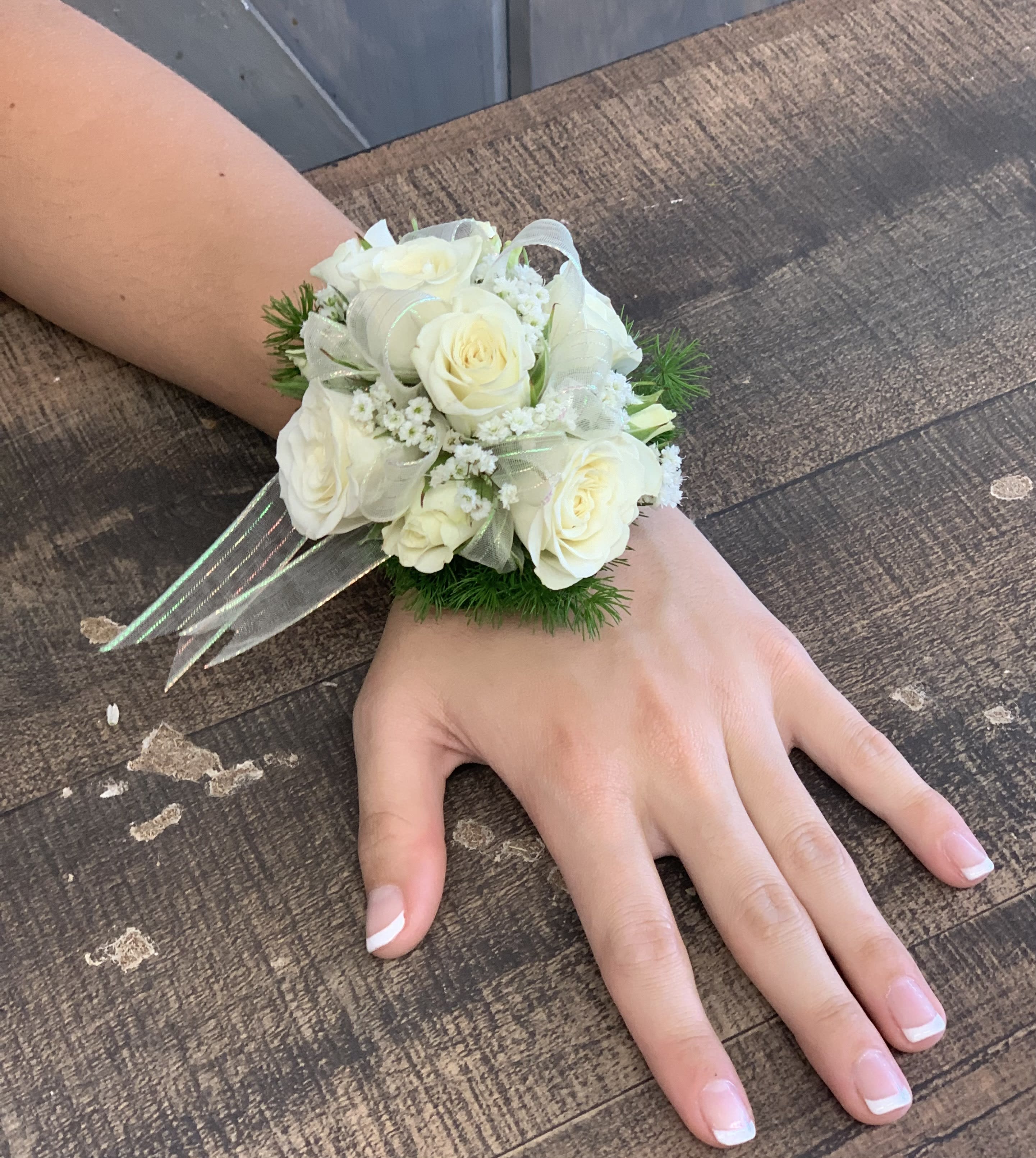 Rose Wrist Corsage - Our rose wrist corsage comes with Spray roses babies breath, ribbon, and a velrow wristlet.