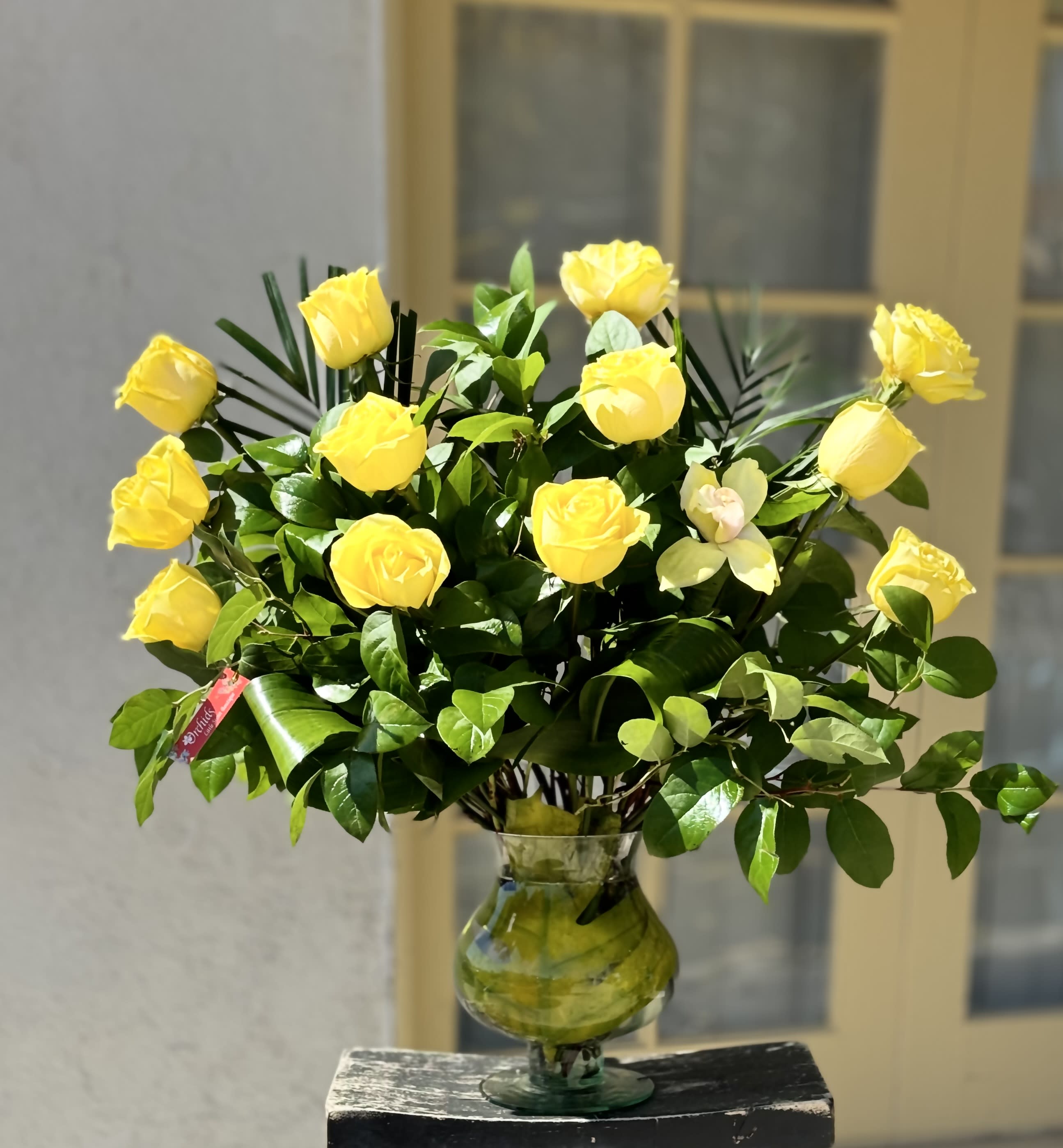 A Dozen -18 Or 36 Long Premium Yellow Roses Sunshine  Bouquet  - Our morning sunshine long stem  yellow roses comes with your choice of a dozen,18, or 36  premium roses. Delivered in a 9&quot; clear glass vase, an elegant surprise for the people you care about for big celebrations and every “just because” moment in between!