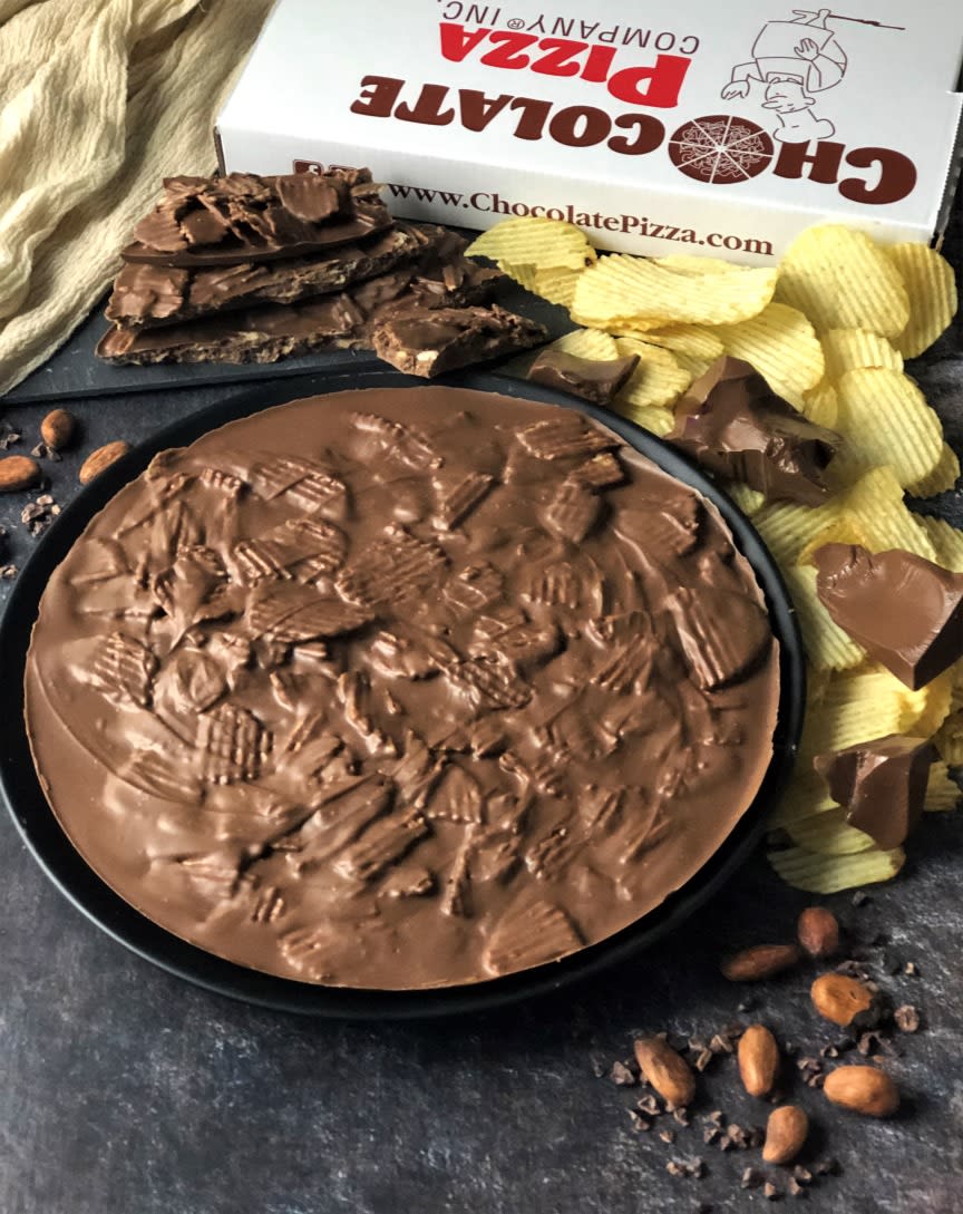 CHocolate Pizza Chip Off the Old Block CHocolate Pizza Chip Off the Old Block - Handcrafted, Chocolate Pizza (10-inch diameter, 16 oz.) Gourmet milk chocolate blended with rippled potato chips Sweet-salty taste combination is delicious. Great gift idea. Served in a custom pizza box. Add a box of PB Wings!