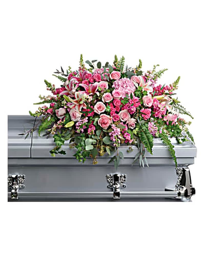 Beautiful Memories Casket Spray Beautiful Memories Casket Spray - Like your beautiful memories, this dramatic spray of pink hydrangea, roses and lilies will take your breath away. A fresh, feminine symbol of hope for the service. This dramatic spray features pink hydrangea, pink roses, pink spray roses, pink stargazer lilies, pink carnations, pink larkspur, pink snapdragons, pink stock, green ivy, sword fern, silver dollar eucalyptus, seeded eucalyptus, and lemon leaf. Orientation: N/A All prices in USD ($)