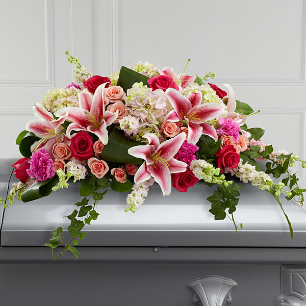 Elegant Grace Casket Spray - Pink hybrid lilies, hydrangea, and roses lend their beauty to this elegant casket spray. A beautiful tribute to your loved one.