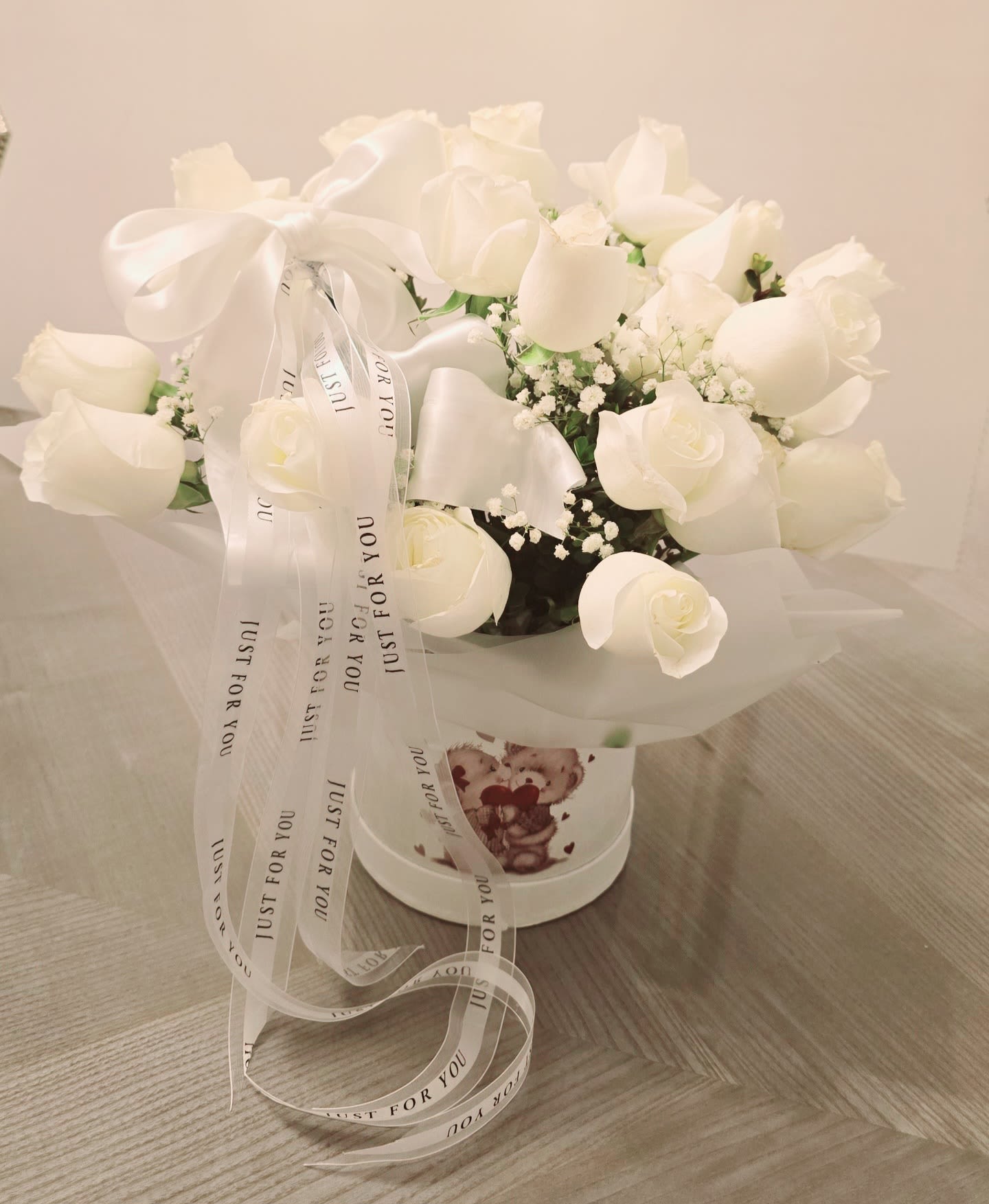 All in White - Roses are always a favorite. Mixing these with green accents makes the arrangement a very spatial.