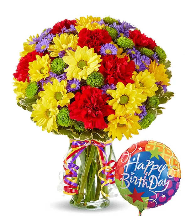 Wishes Bouquet - Make all their birthday wishes come true with this beautiful bouquet of red carnations, yellow daisies, purple Monte Casino blooms and green button poms. Hand arranged and delivered by one of our local florist in a clear fluted vase with a colorful curly ribbon and a birthday mylar balloon.