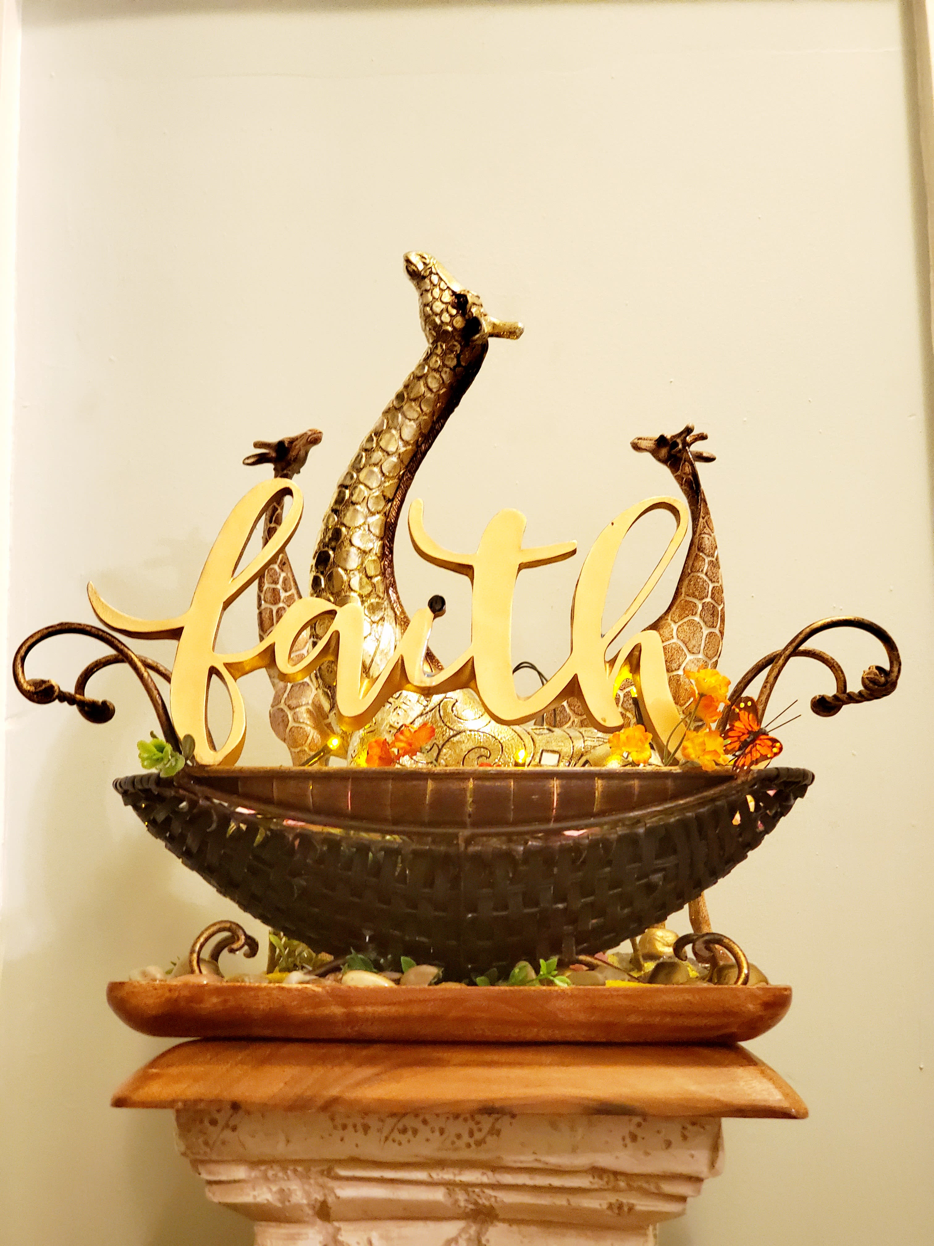 Giraffe with Lights - Faith - Giraffe figurines accented with flowers, lights, and butterflies. Connected to a wooden tray. Golden &quot;Faith&quot;
