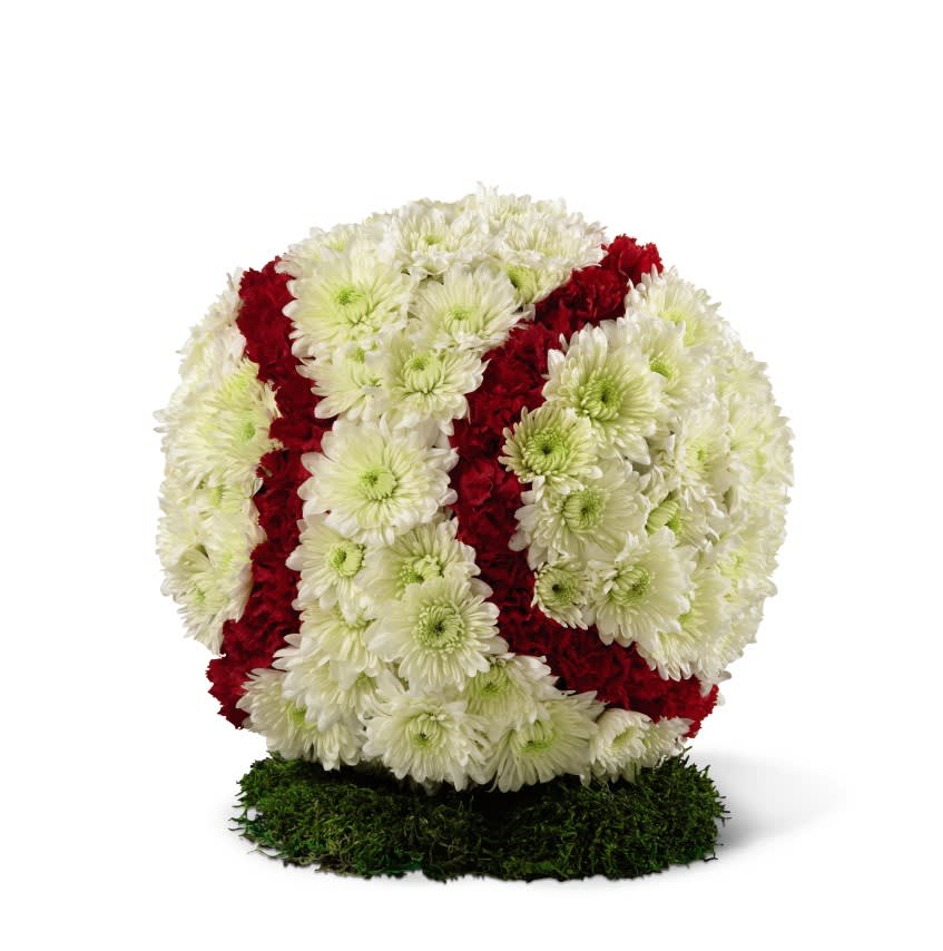 Baseball Tribute - What a fantastic way to honor a true baseball fan! This sphere covered in white chrysanthemum poms and red spray carnations is approximately 12&quot; in diameter and sits on a stand covered in moss. 