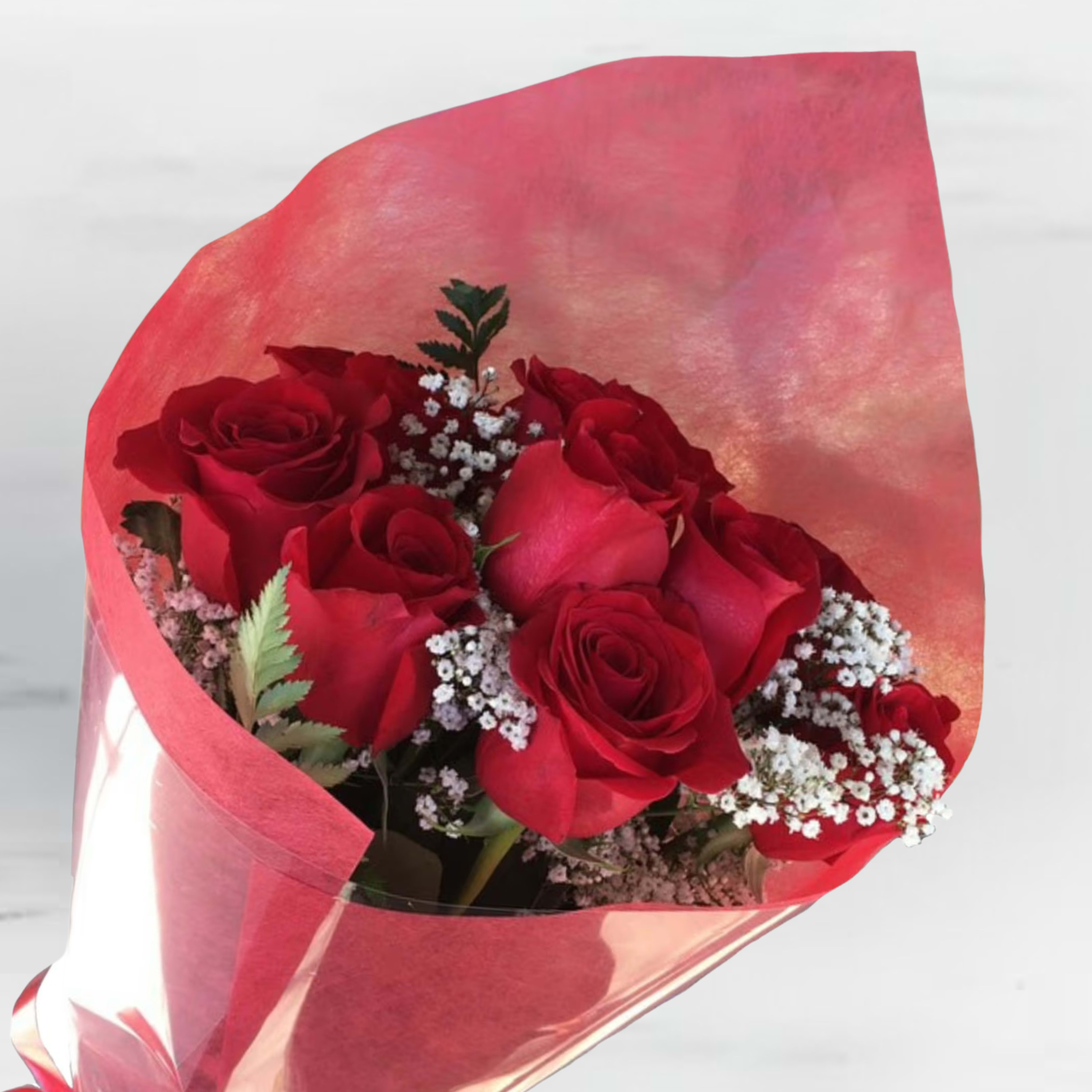 Wrapped roses Wrapped roses - A stunning bouquet of 12 elegantly wrapped roses, symbolizing love and appreciation, complemented by delicate sprigs of baby's breath for a touch of airy charm. The roses, available in classic red, soft pink, pure white, or a custom color of your choice, are artfully arranged with lush greenery and wrapped in stylish paper or a sleek presentation box. Perfect for romantic gestures, heartfelt celebrations, or simply brightening someone’s day with timeless beauty.