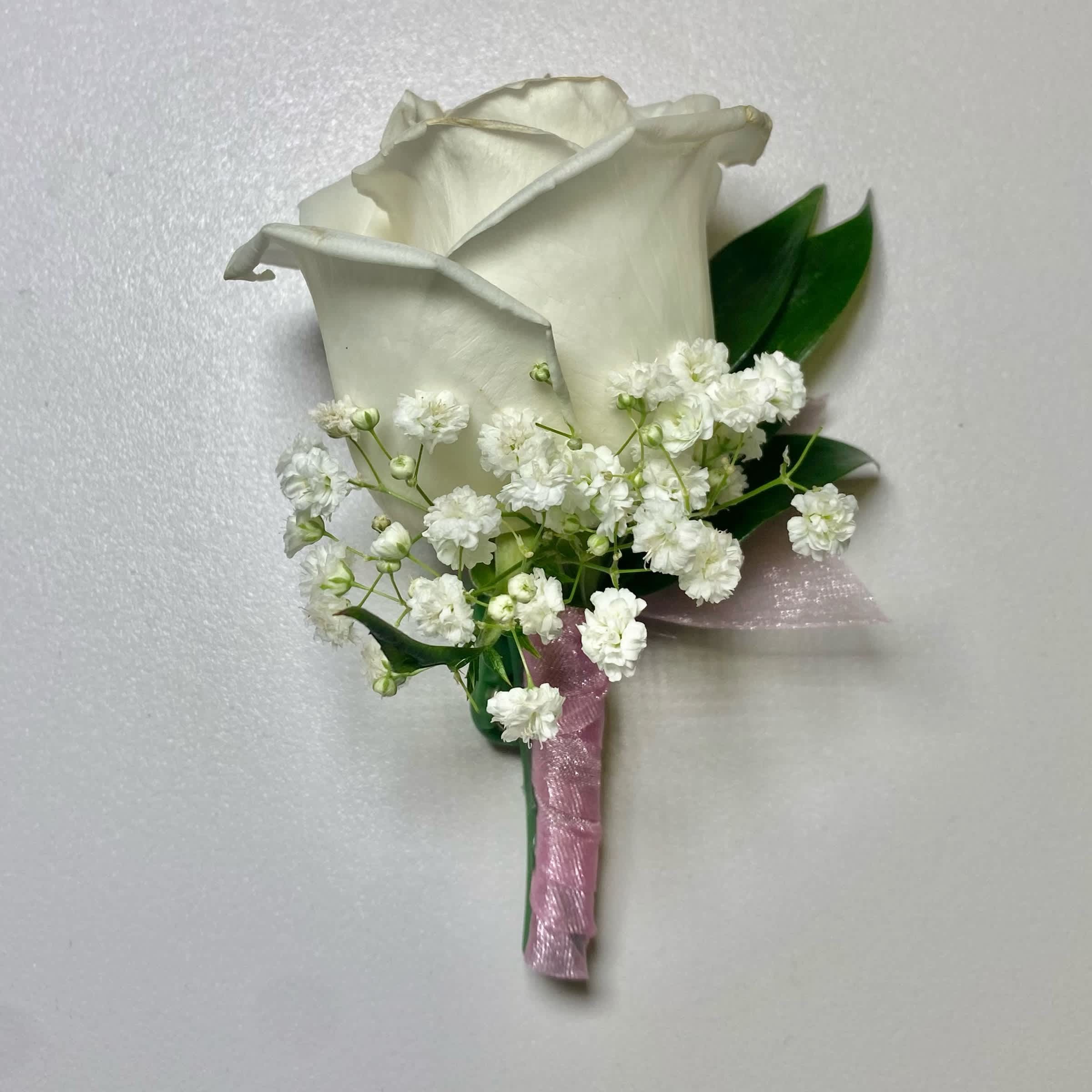 Light Pink/ White Rose Boutonniere - This White Rose Boutonniere Includes, Light Pink Chiffon Ribbon, White Rose, Babies Breath, and Gentle Greenery. Or as Similar as Possible.