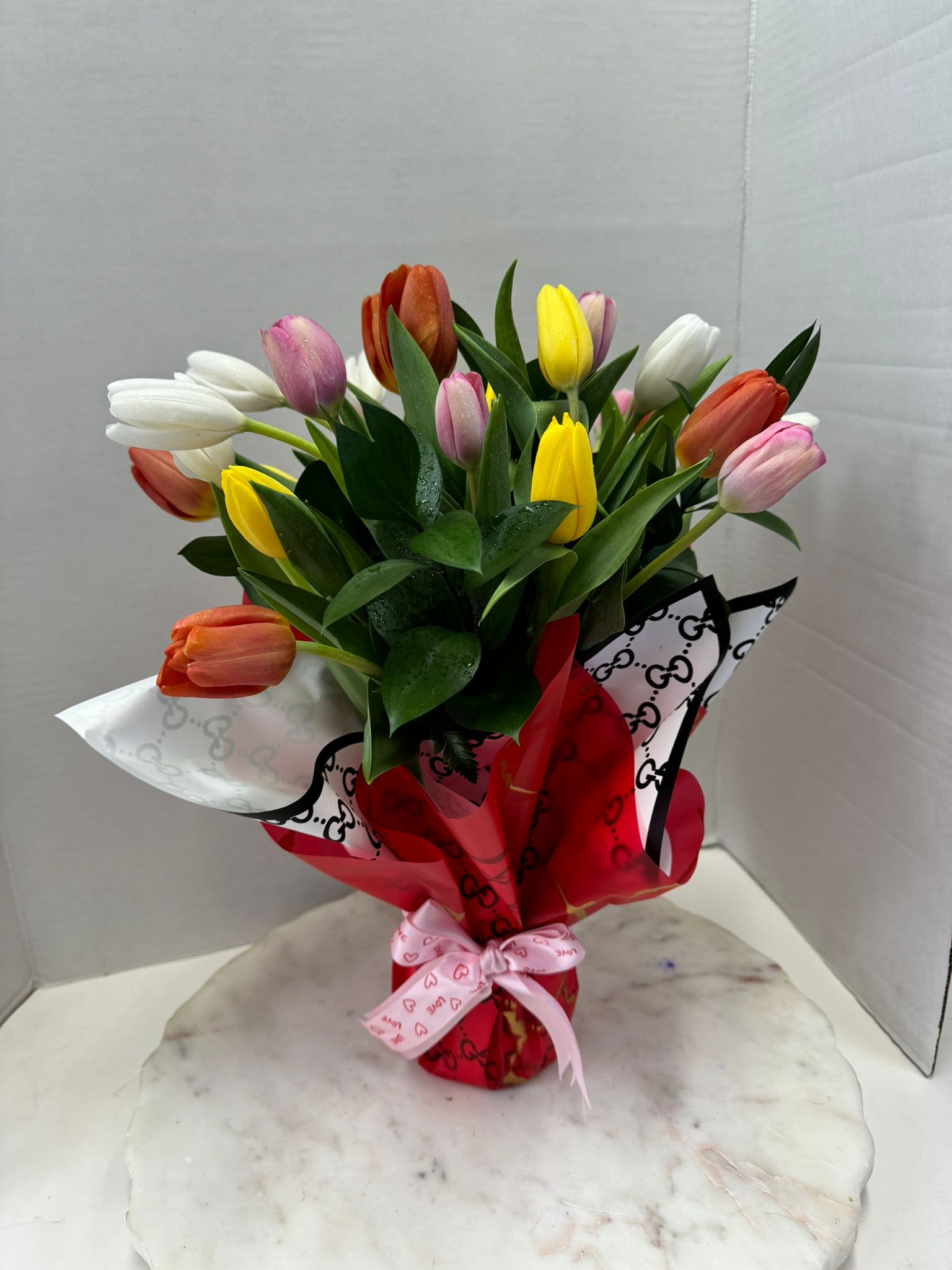 Mixed Tulips  -   Bouquet is a favorite for every girl! These delicately hand-tied bunches are an ideal gift for any occasion. With a present as delightful as this, you're certain to make a lasting impression on the woman in your life 