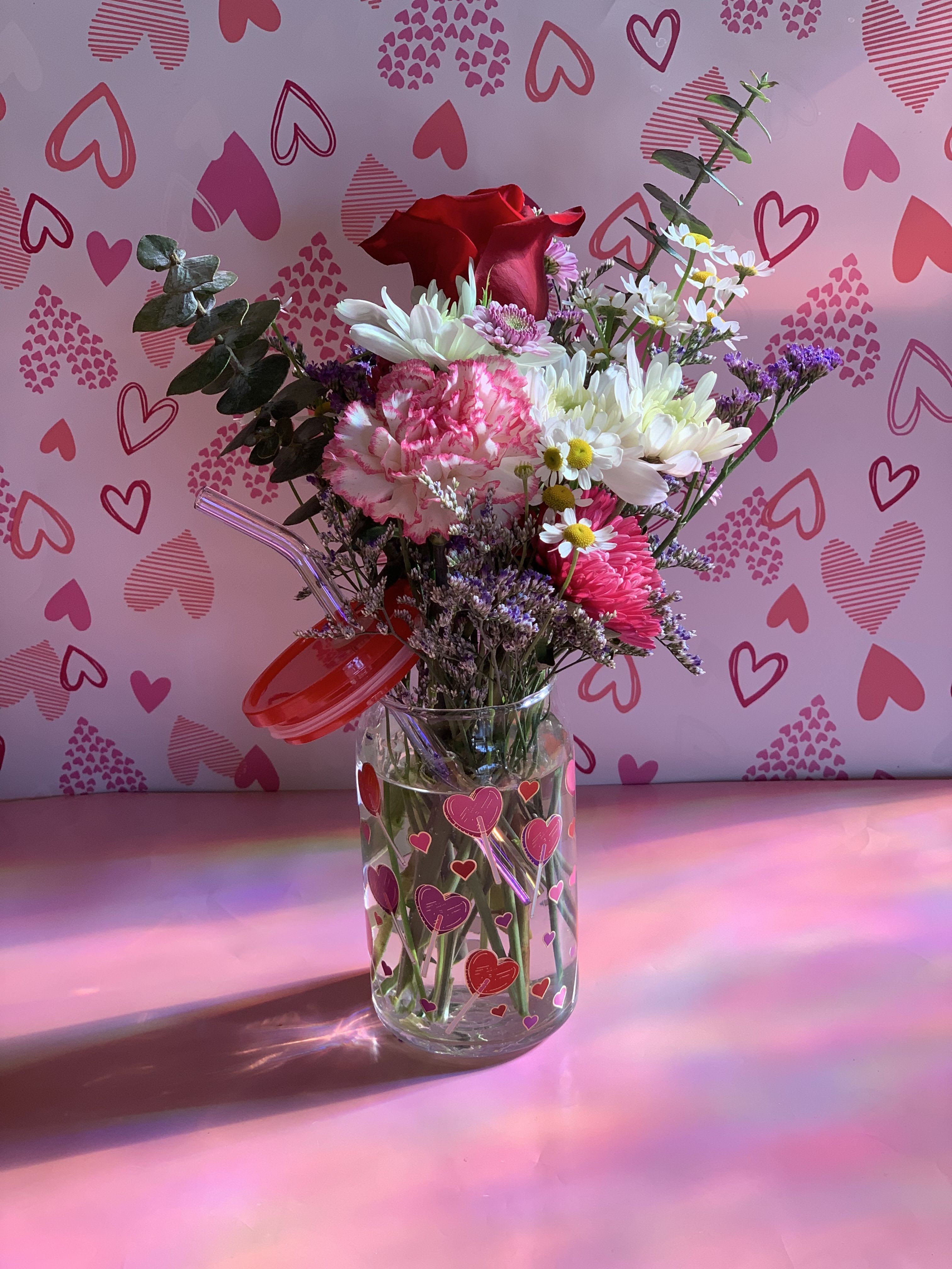 Tumbler of Love - Take a ride in our &quot;Tumble of Love&quot; Introducing the distant cousin to our signature design and crowd favorite the Hug In A Mug. This glass tumbler will vary by holiday and so will the flower selection. 