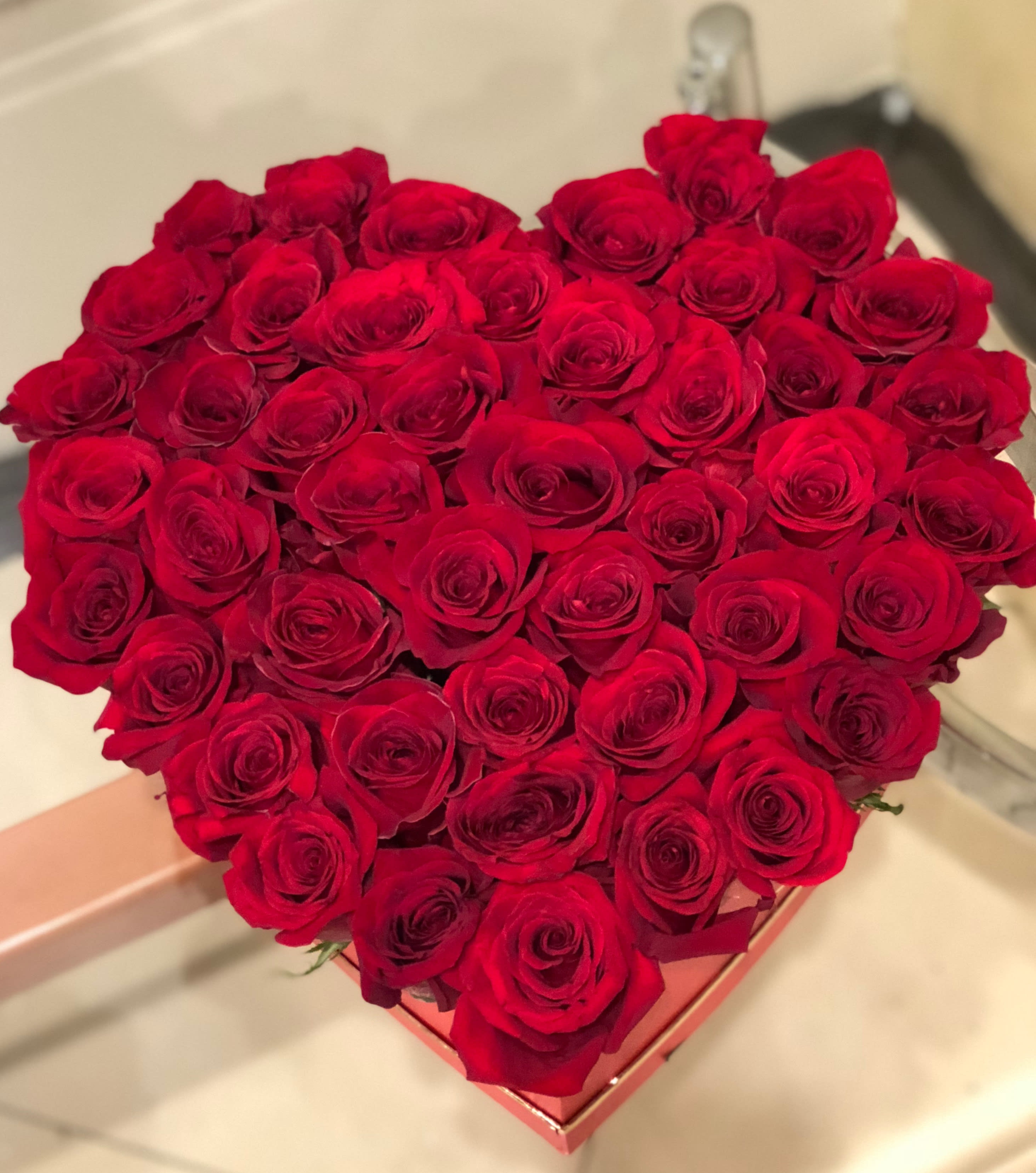 Be My Valentine by Laazati - There are about 40-50 red roses in this arrangement.    Please note from Feb11 to Feb15 We are not able to take Time Requests for delivery.  All deliveries will be made between 8am-10pm  Thank you Each arrangement recreated this item description will not be identical to this image. The Flowers may be substituted for another type of flowers at the same value or grater. All Sales Are  Return Policy  All of our sales become final when order gets delivered and signed for. There will be no refund or exchange after delivery.  