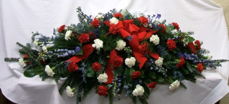Full Couch Red, White &amp; Blue - 5' full couch 4dz red &amp; white carnations, delphinium &amp; limo &amp; greenery