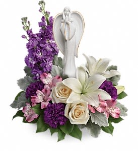 Teleflora's Beautiful Heart Bouquet - An elegantly unique expression of your deepest condolences, this majestic mix of crème, white and lavender blooms includes fragrant roses and lilies to refresh and rejuvenate their spirits. Nestled among the blooms is a graceful angel sculpture - a serene, spiritual keepsake they'll always treasure. Flowers and colors may vary. (Designed at the standard price point)