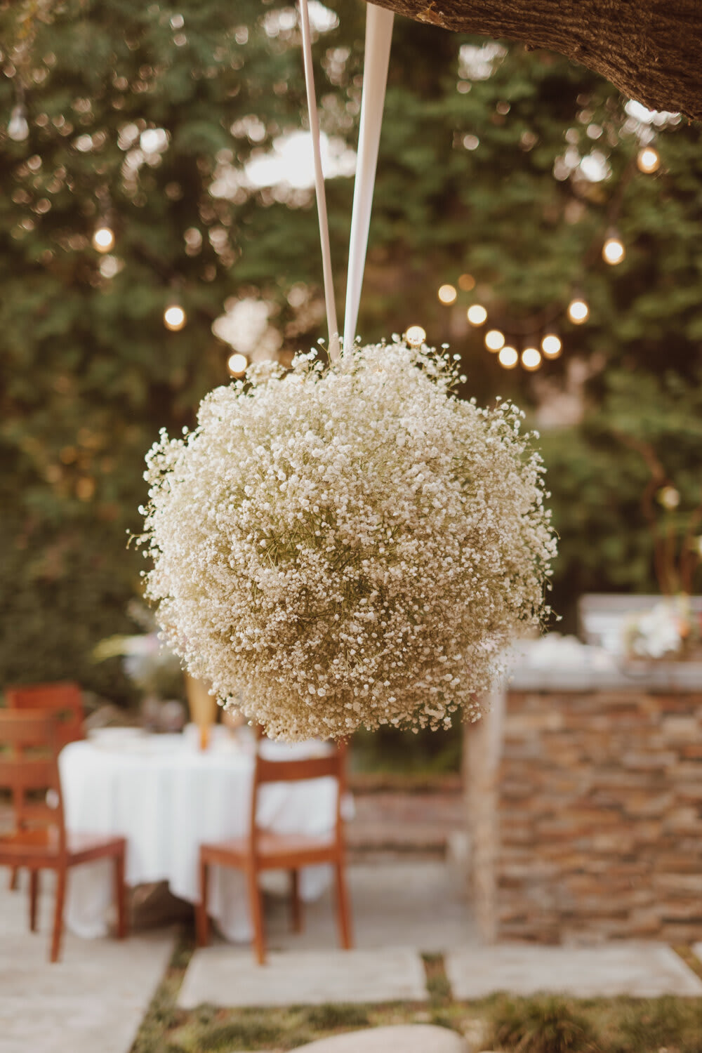 The Ball The Ball - An elegant flower ball hanging to bring whimsical beauty to your event. A collection of these floral orbs will build an atmosphere that is otherworldly.