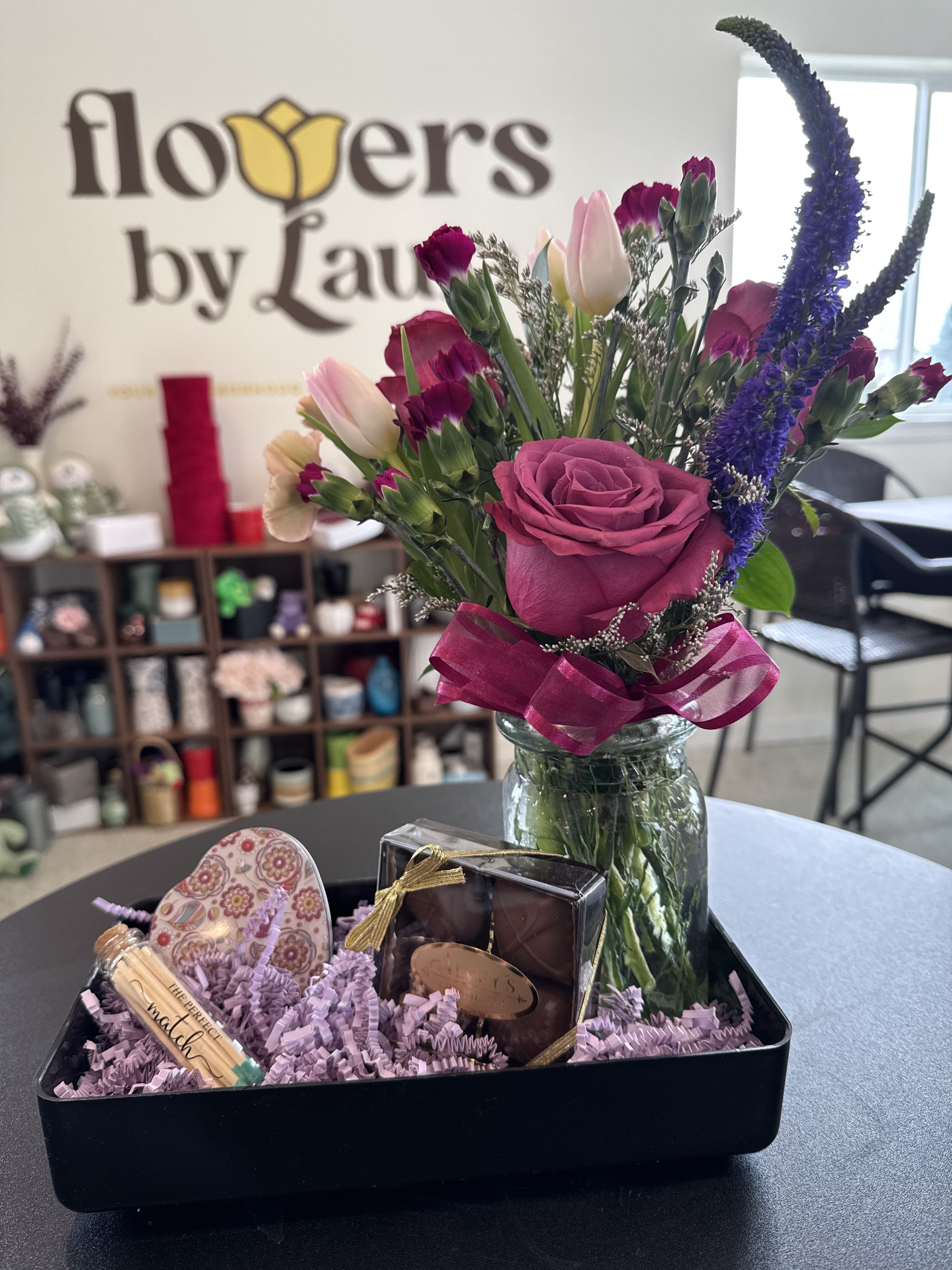 Romantic Evening - A fun treat for the two of you.  The gift ready to go comes with the following; 1 candle, &quot;a perfect match&quot; jar of matches, a box of Alvey's chocolates, and a vase of flowers.  Standard: Pictured vase of flowers and 4 pieces of Alvey's chocolates  Deluxe: Larger flower vase and 1/4 lb Alvey's choclates  Premium: Even larger vase of flowers and 1/2 lb Alvey's chocolates