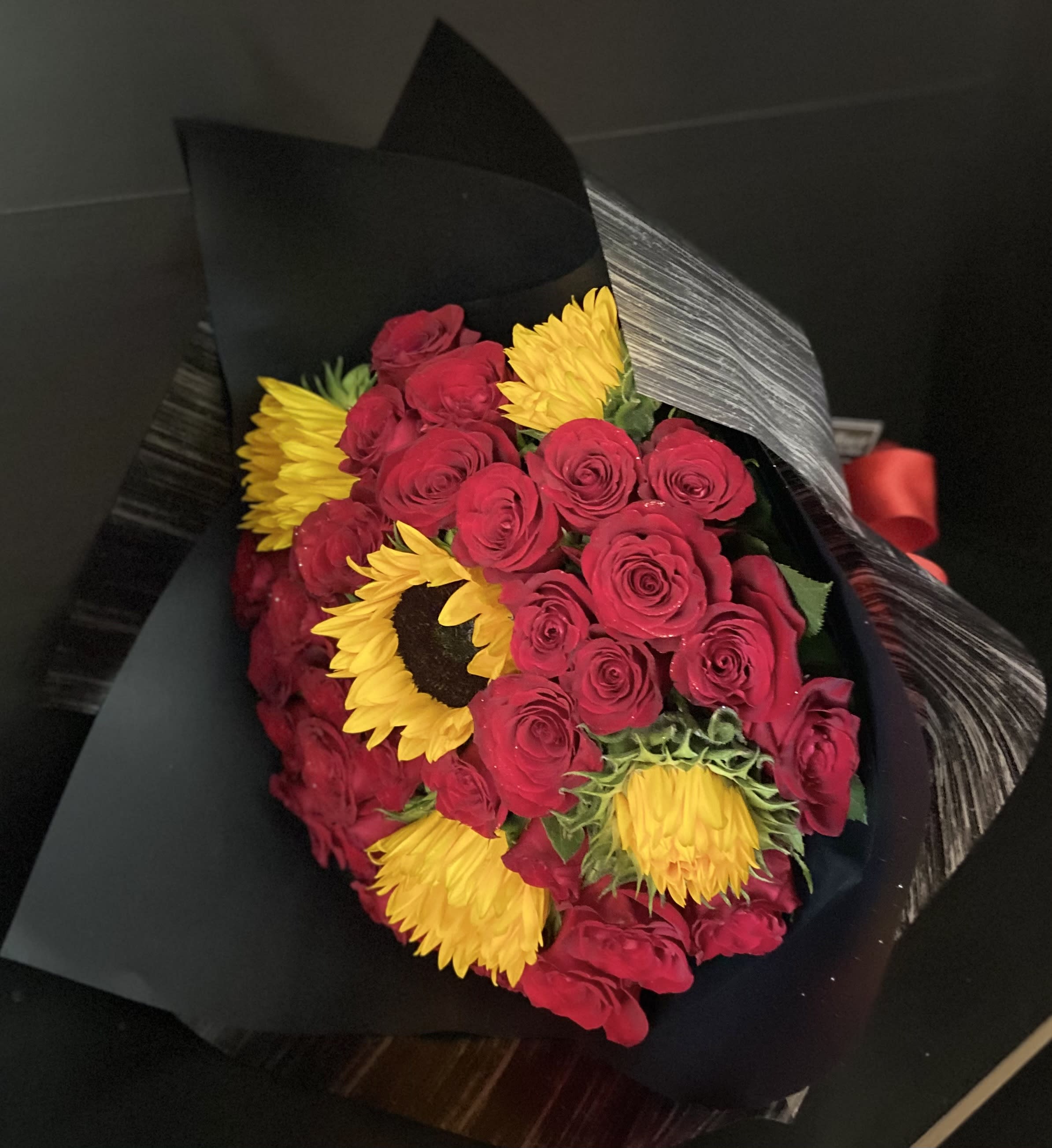Sun Roses 24 - 24 Red Roses and 5 Sunflowers wrapped Black Paper