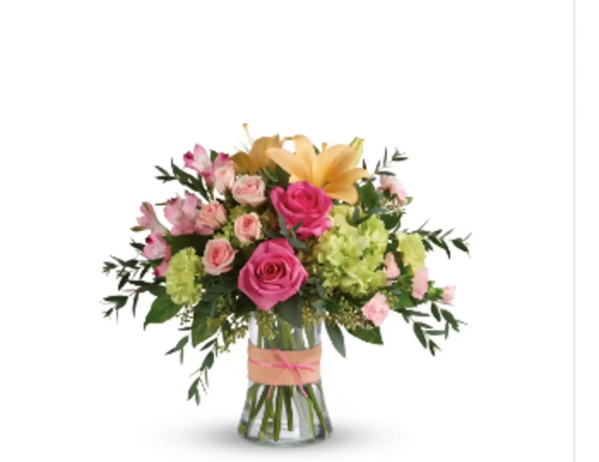 Charm of Blooms - Introducing &quot;Charm of Blooms,&quot; a captivating floral arrangement that embodies the beauty of nature's colors. This arrangement features a delightful blend of green hydrangea, hot pink roses, pink spray roses, peach asiatic lilies, pink alstroemeria, green carnations, pink miniature carnations, all gracefully accented by seeded eucalyptus, parvifolia eucalyptus, and lemon leaf. It's a charming and vibrant expression of your sentiments, perfect for any special occasion. Vase may vary and reasonable flower substitutions may be required due to seasonal availability.