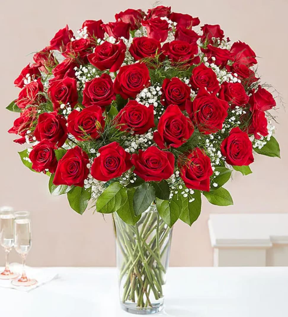 Ultimate Elegance™ Long Stem Red Roses - Our luxurious long stem red roses are the ultimate surprise to say “I love you.” Four dozen radiant blooms are artistically arranged by our expert florists inside an elegant glass vase and personally hand-delivered to help you say how you feel in a truly romantic way.