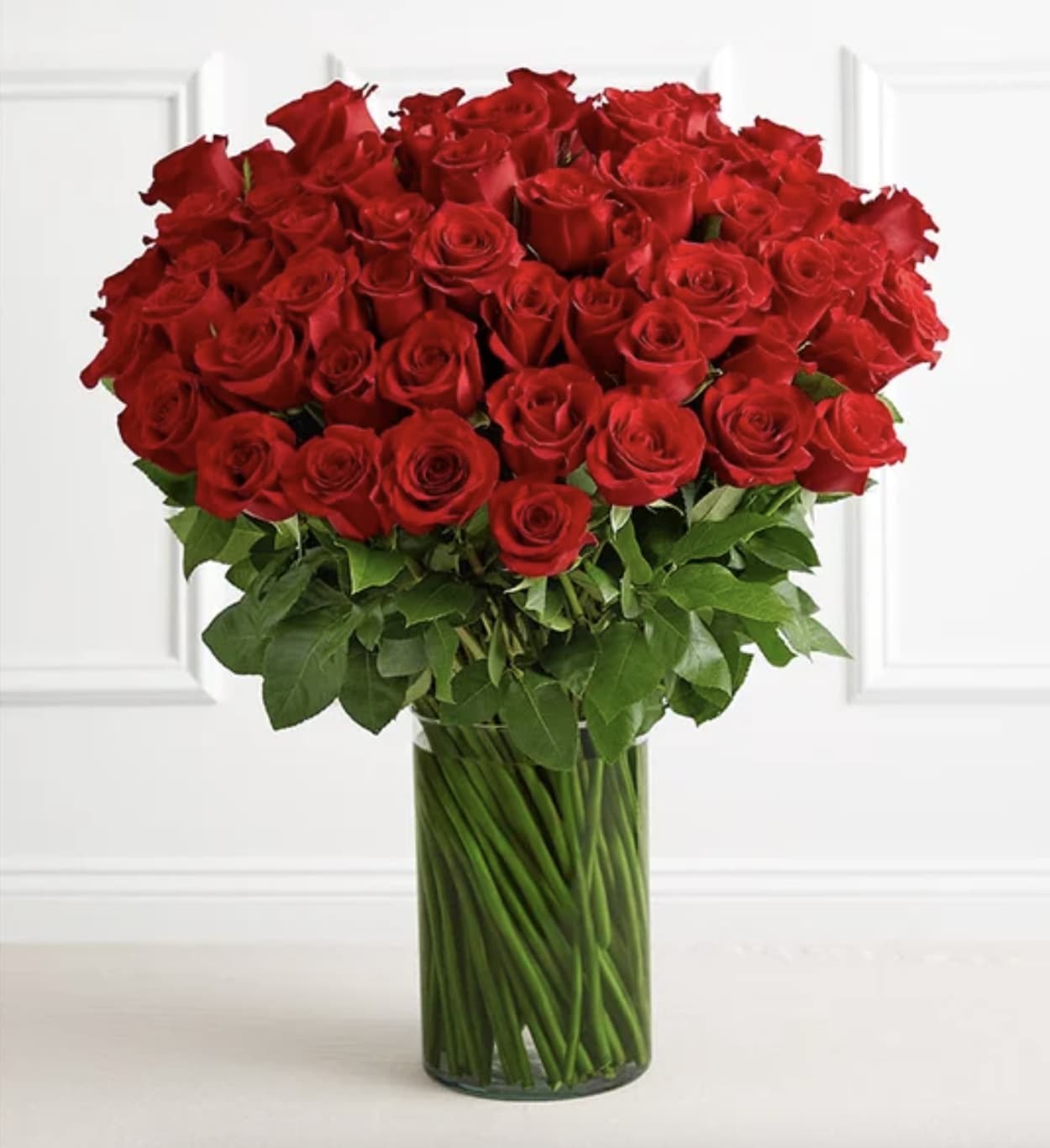 Spectacular Rose™ 100 Long Stem Red Roses Bouquet - Give the ultimate WOW this Valentine’s with a gift of floral luxury. We’ve gathered 100 long-stem red roses, grown and picked at their peak, then hand-selected for their size and beauty. Presented in a classic glass cylinder vase, the stunning arrangement says “I love you” as no other gift can. 