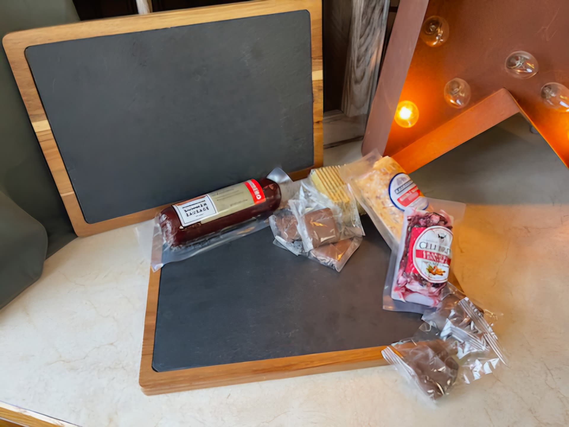 Charcuterie Snack Attack (Engravable Options) - Send a unique gift with an engravable slate and back side is a cutting board topped with select fruit, candies and upgrade for meats and cheeses and drink tumbler