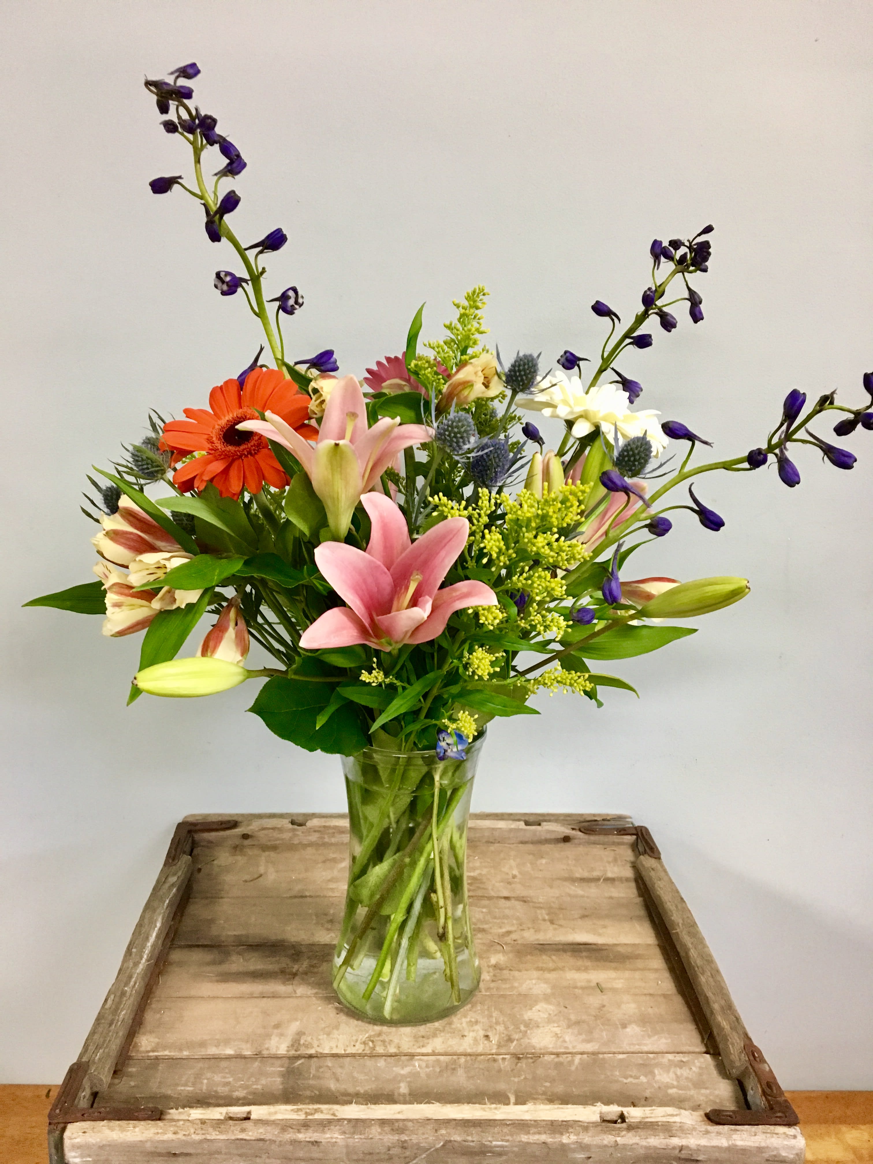 Backyard Beauty Backyard Beauty - This beautiful garden medley feels as though it was fresh picked from the back yard. A variety of different flowers and colors come together in this appealing design.