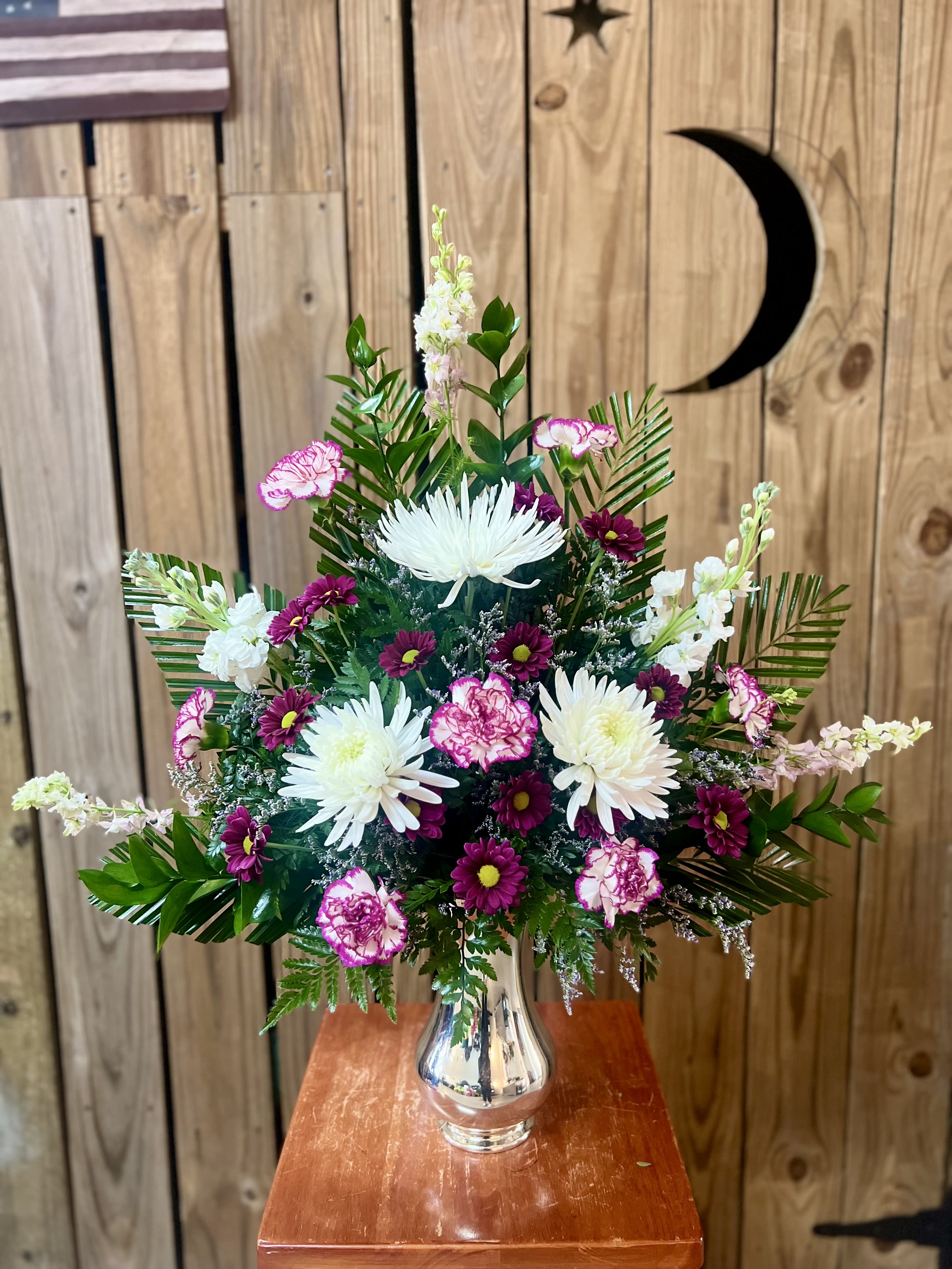 Altar Arrangement Altar Arrangement - These beautiful alter arrangements are designed to accent the alter for worship services. Colors are season and appropriate for holidays. Talk to one of our designers today.