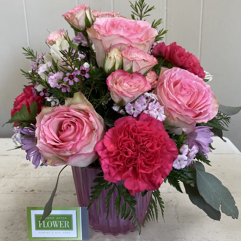 Mother’s Rosy Posy Mother’s Rosy Posy - Celebrate the sparkle that mom brings to your life with this Rosy, radiant and perfectly posh floral arrangement in a pearlescent pink glass vase with sculpted details. It is the perfect Mother's Day surprise. Flowers may vary slightly