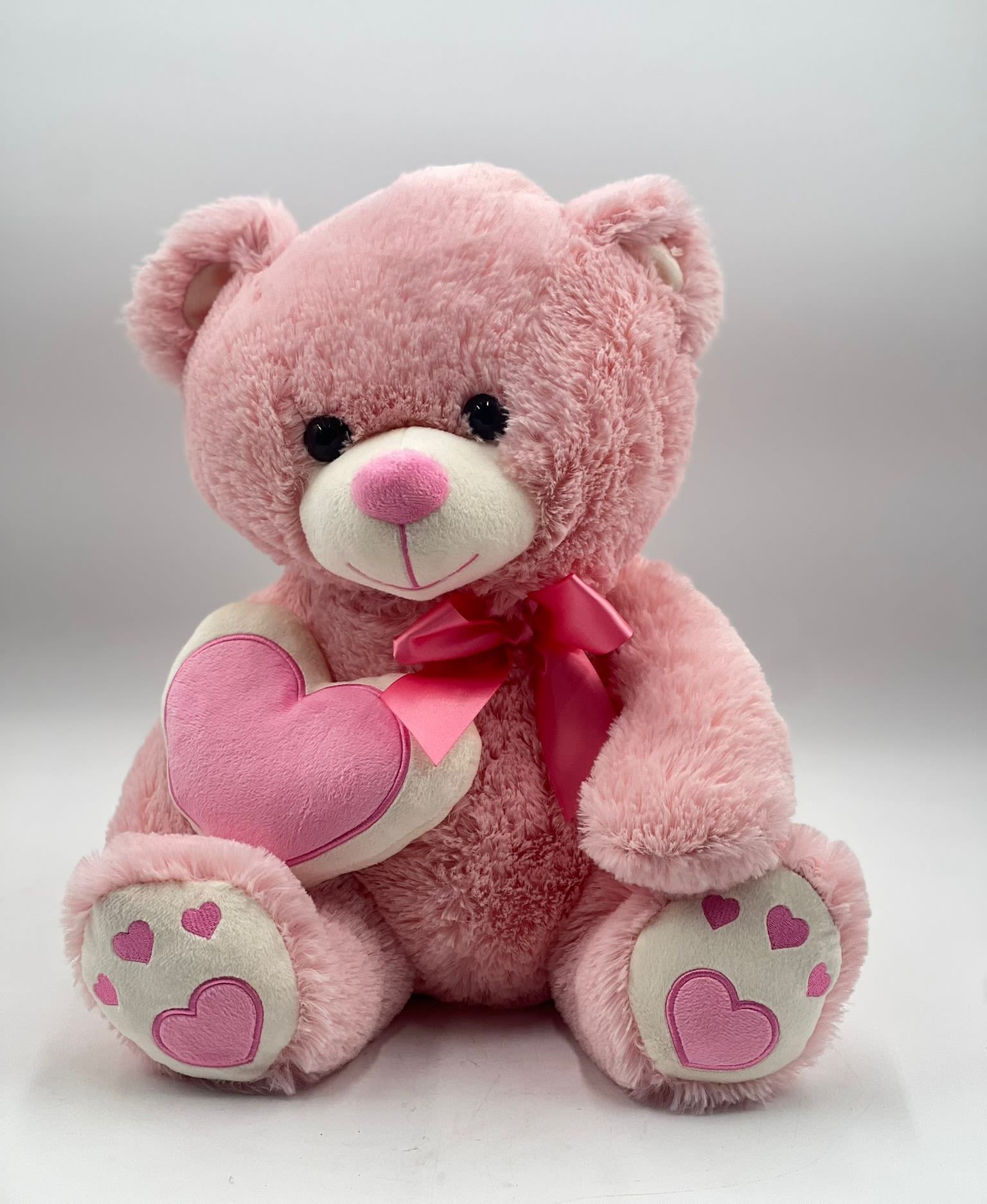 Sweetheart Pink Teddy Sweetheart Pink Teddy - Standing at 15 inches tall, this soft Teddy Bear features a charming pink design, adorable heart details on its paws, and a matching heart plush for an extra touch of sweetness. Finished with a silky pink ribbon, this lovable bear makes the perfect gift for Valentine’s Day, anniversaries, or any occasion when you want to share warmth and affection.