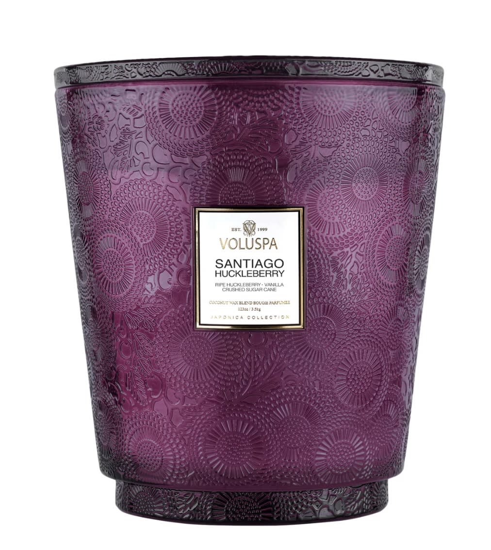 Voluspa Hearth Candle - Santiago Huckleberry - Playfully tart summer berries explode and trickle delicately as their sweet juice is enveloped into a cloudburst of Vanilla Bean and Sugar Cane.  Voluspa's unique coconut wax blend is hand-poured into a 123 oz. embossed glass vessel and topped with a matching lid that keeps the candle dust-free when not in use. Our five wicks allow you to enjoy fragrance throw for 250 hours. Our candles are hand-poured in the United States and feature our proprietary, clean-burning coconut wax blend and 100% natural wicks. Our products are free of phthalates, pesticides, parabens and sulfates and are never tested on animals. Up-cycle this best seller into a keepsake after the last burn.