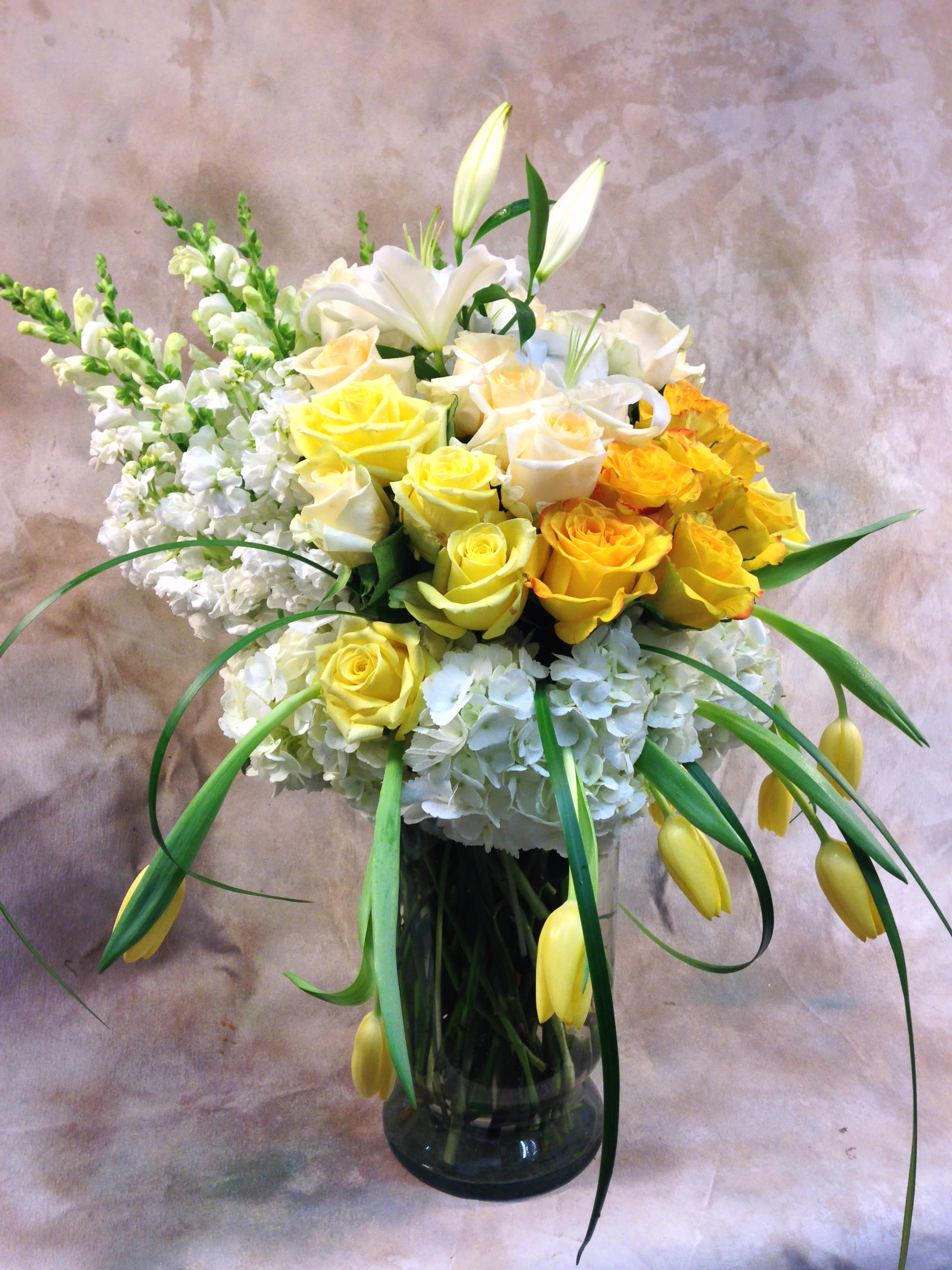 Ombre Style Ombre Style - Snapdragons, roses, tulips and hydrangea in a compact ombre style.