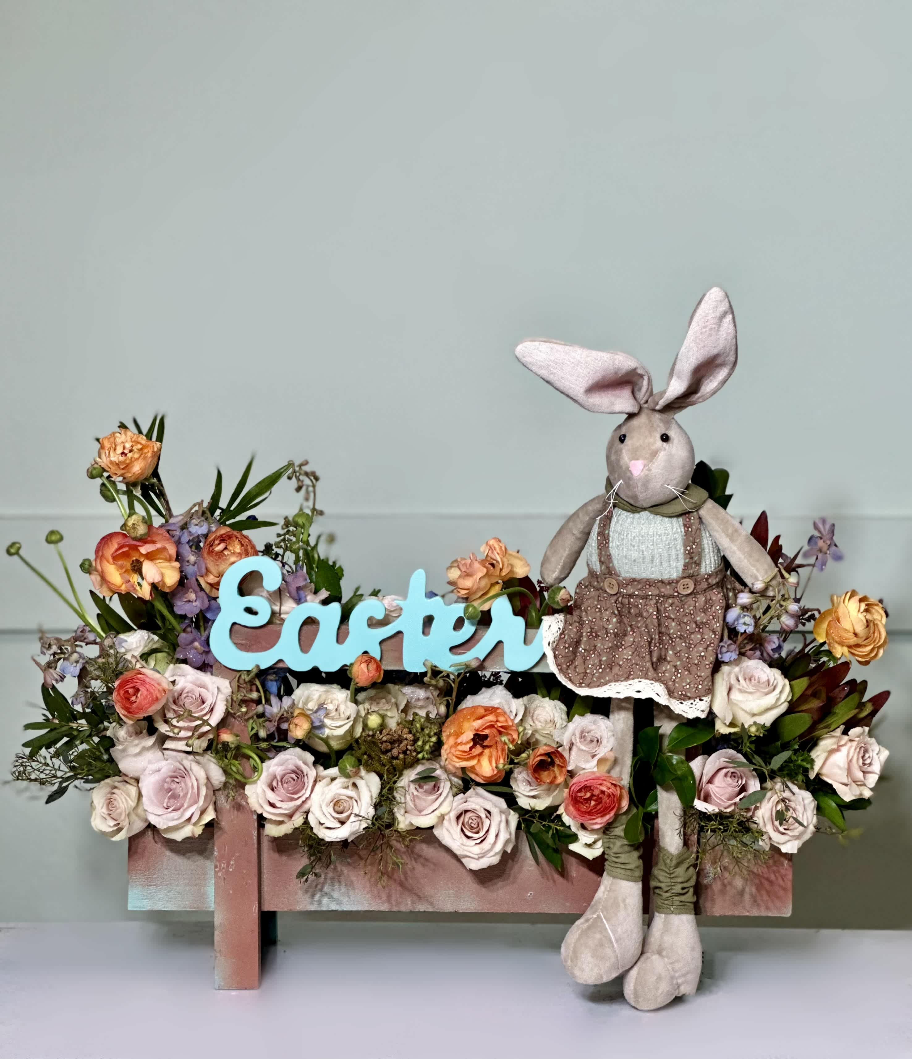 Easter  - Roses, Ranunculuses , Safaris, Delphiniums , Hydrangeas and a beautiful stuffed bunny in a wooden box. 