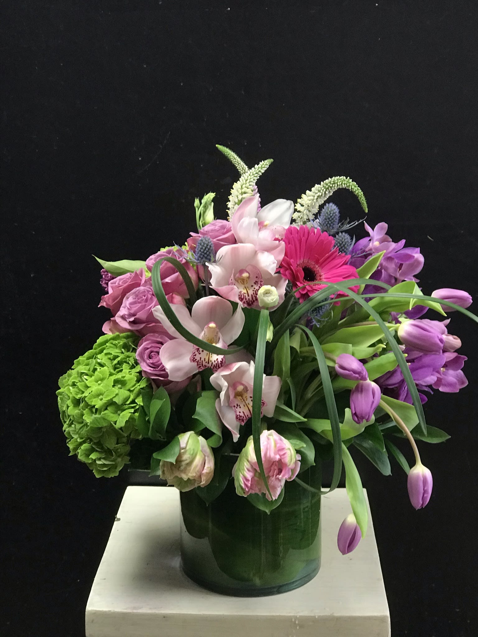 Leaning In Leaning In - Asymmetrically designed tabletop piece that summons up images of brook-side greenery and spring flowers.
