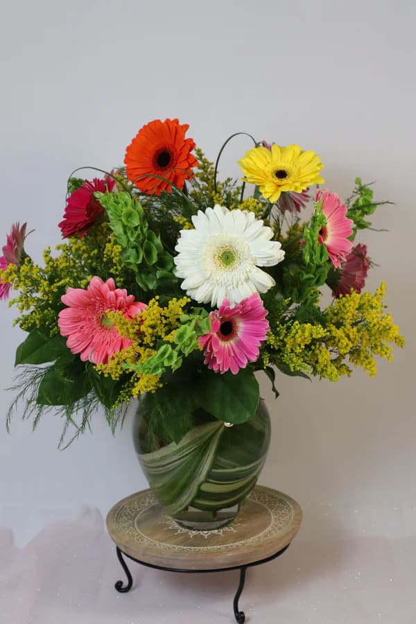 Jumping for Joy - Make your loved one jump for joy with this beautiful mixed gerbera floral arrangement, sure to bring happiness to anyone's face.