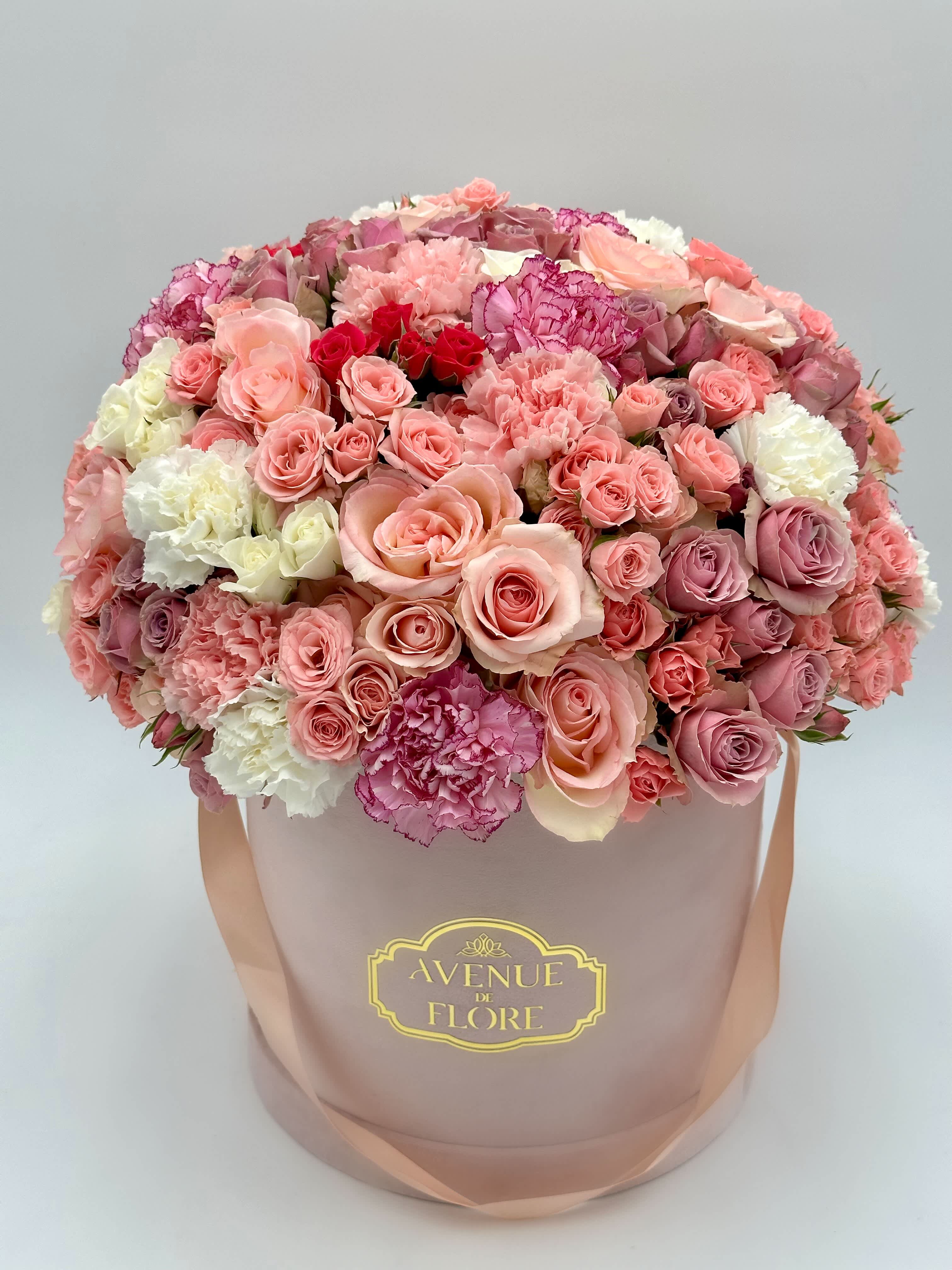 Blooming Garden Blooming Garden - A captivating floral arrangement that encapsulates the enchanting beauty of blossoms in a harmonious symphony. This arrangement is a timeless display that speaks volumes of love, tenderness, and the beauty found in every moment.