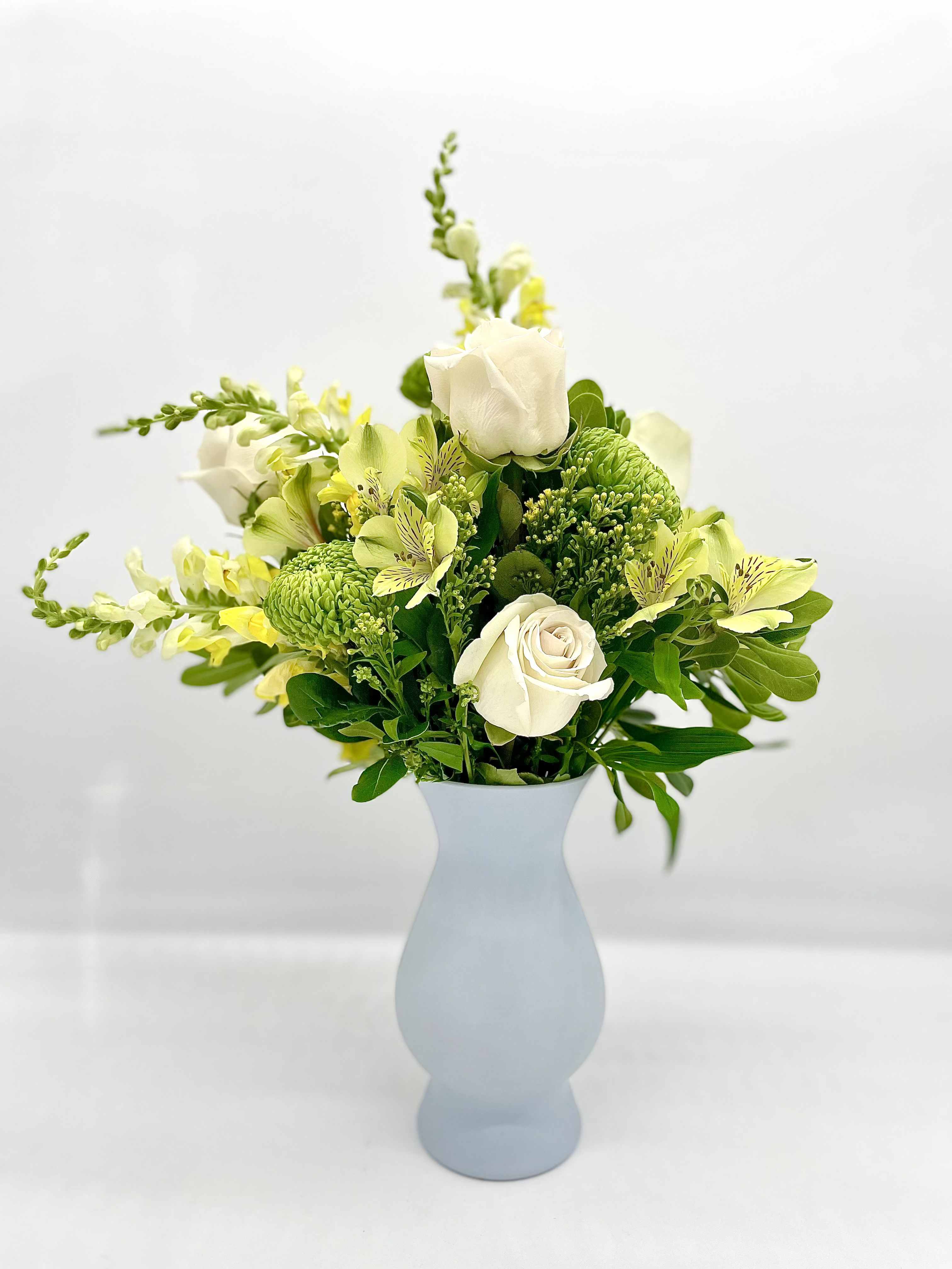 Costal Sunbeam - This arrangement evokes the feeling of sunlight reflecting off the ocean, blending the warmth of yellow with tranquility of the blue vase. All bouquets are arranged by our professional floral design team accented with seasonal filler (i.e. greenery, baby’s breath, etc.) inside an elegant glass vase or gift box. When artistically designed in a clear glass vase arrangement measures approximately 23&quot;H x 18&quot;L.   Blooms are hand delivered in person to enhance any celebration or a “just because” surprise. Deliveries are done between 10am - 5pm. If the recipient is not home, we will leave the delivery if safe from the elements. We will call or text the recipient and let them know a delivery has been left.