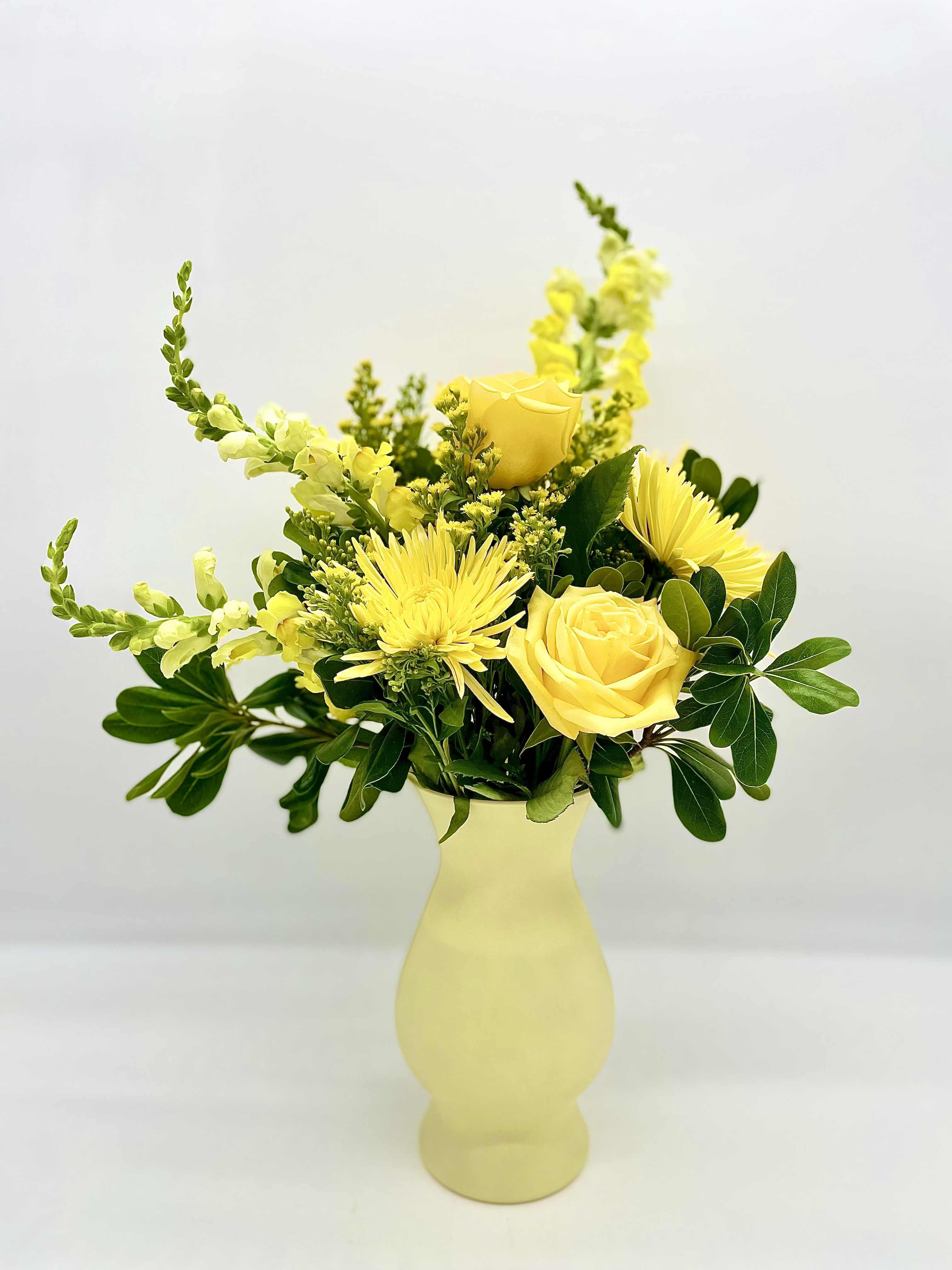 Lemonade Love - Show them your affection with this sweet and refreshing arrangement of yellow blooms. All bouquets are arranged by our professional floral design team accented with seasonal filler (i.e. greenery, baby’s breath, etc.) inside an elegant glass vase or gift box. When artistically designed in a clear glass vase arrangement measures approximately 23&quot;H x 18&quot;L.   Blooms are hand delivered in person to enhance any celebration or a “just because” surprise. Deliveries are done between 10am - 5pm. If the recipient is not home, we will leave the delivery if safe from the elements. We will call or text the recipient and let them know a delivery has been left.