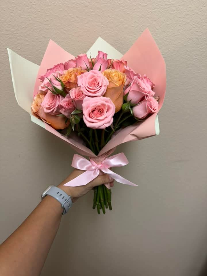 Pink wrapped bouquet - Pink roses and assorted flowers wrapped