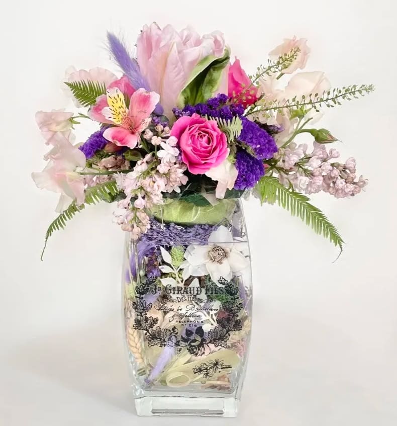 Blooming Potpourri Blooming Potpourri - A little something special...and scented! After the flowers are gone, you'll still have potpourri delivering a flowery fragrance to your space. A sweet arrangement of pink and purple flowers comes delivered on a vase of potpourri. This is one you'll only find at Oakbrook Florist!