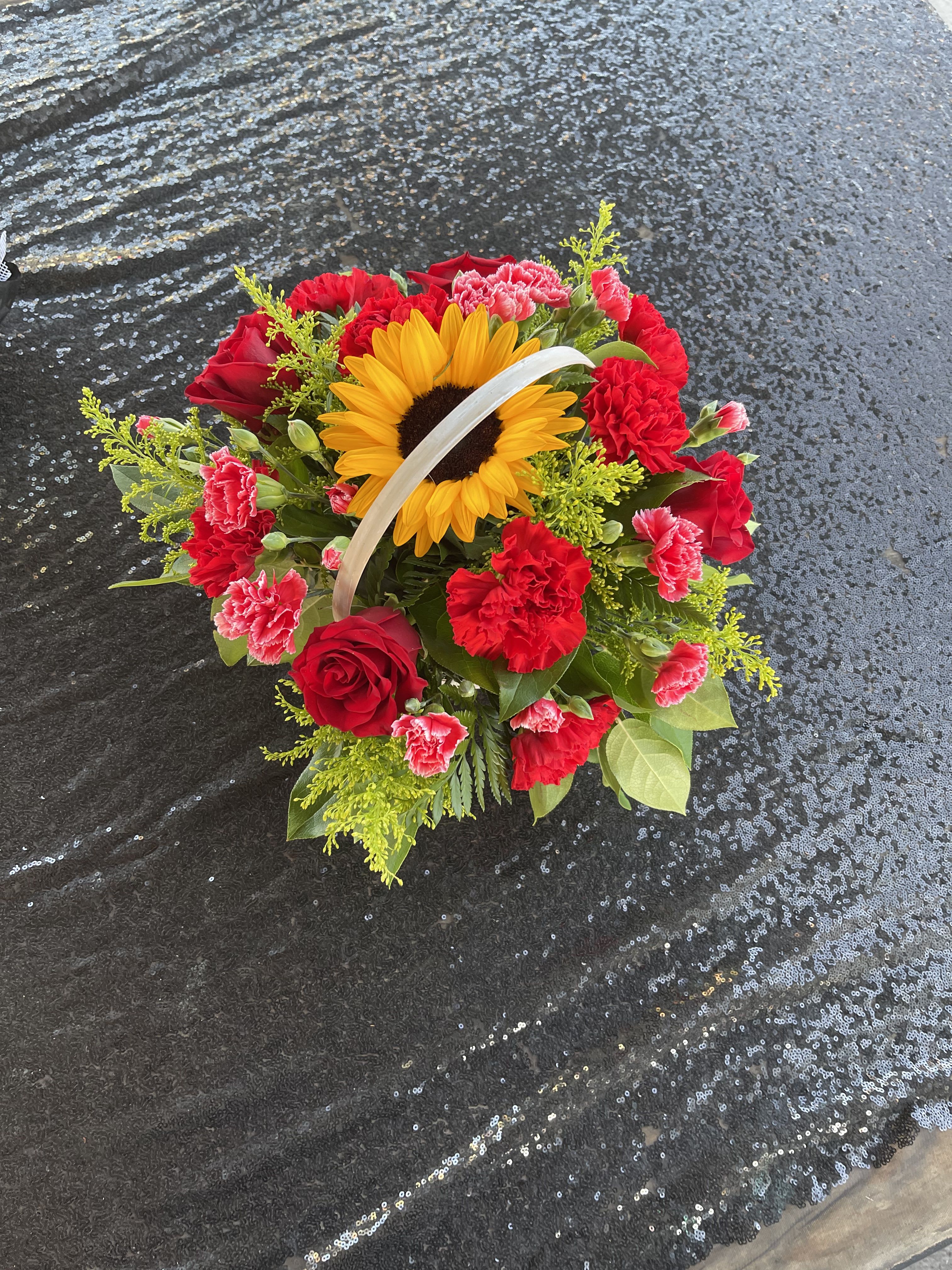 Mini Sunflower Basket Mini Sunflower Basket - Mini sunflower basket with red roses, red carnations, solidalgo, and leather leaf