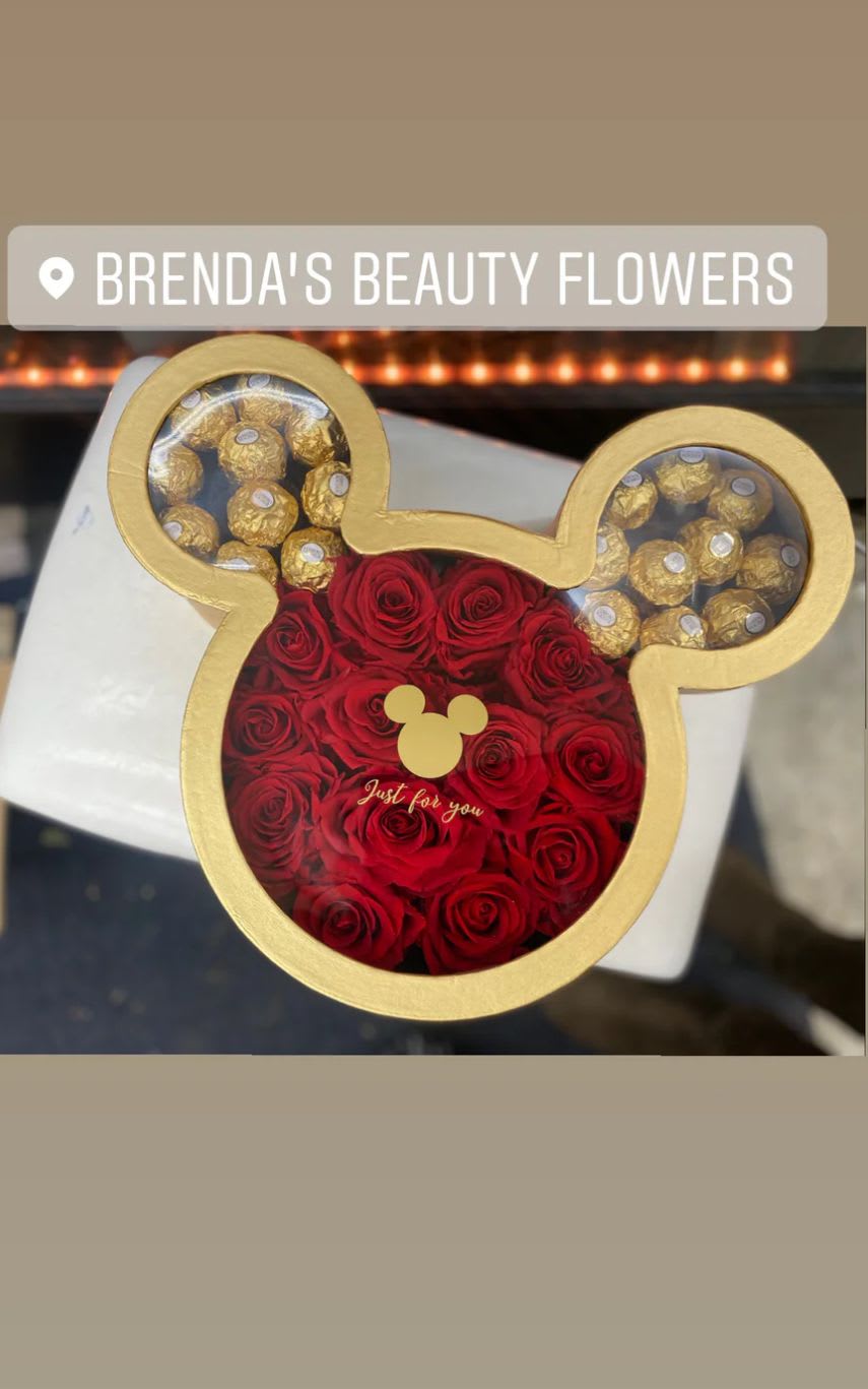 Mickey Mouse box Mickey Mouse box - Chocolates and roses let us know if you would like red or pink roses . for the box sometimes we have the gold , white or pink .