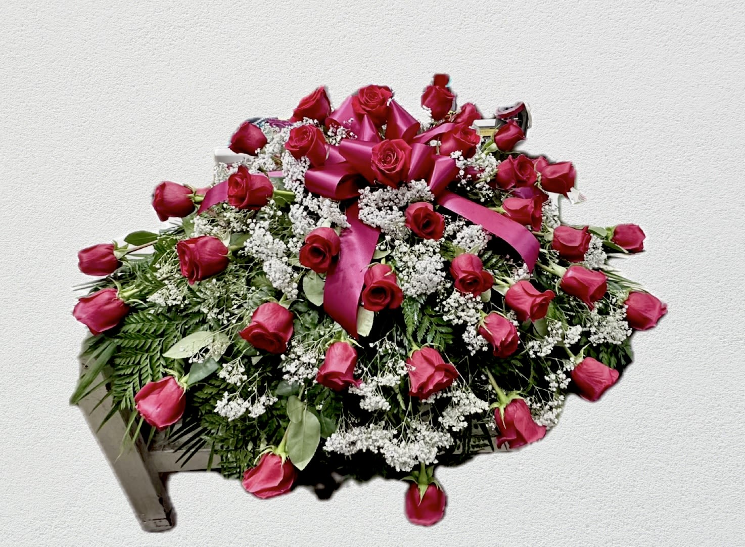 Red rose casket spray - Red rose and baby breath 