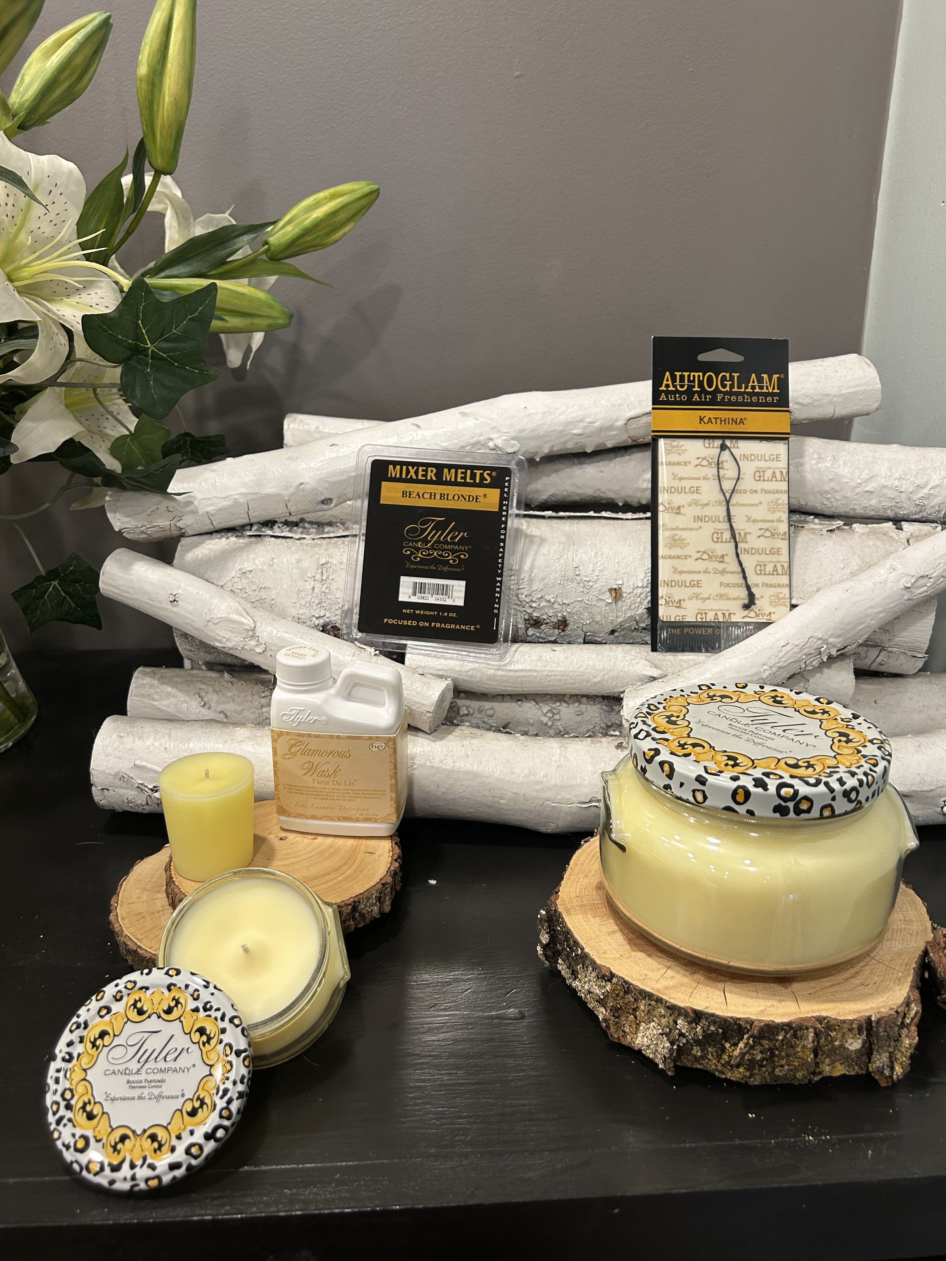 Beach Blonde Gift Set - It sounds like Beach Blonde® is a luxurious and beachy-scented product line that evokes the essence of a sun-soaked, beachy getaway. The description suggests a strong, fresh fragrance with notes of sand, suntan oil, and sea mist, perfect for creating an inviting atmosphere reminiscent of the beach. Here's a breakdown of the items: Large 22oz Candle: A big candle to fill your space with that warm, beachy scent. Small 3.4oz Candle: A more portable version of the larger candle, great for travel or smaller spaces. 15-hour Votive: A smaller candle with a longer burn time for extended enjoyment. 112g Luxury Laundry Detergent: A premium detergent that leaves your clothes with an amazing scent after washing. Autoglam Car Freshener: Keeps your car smelling like a day at the beach. It seems like a perfect set for someone who loves beach-inspired fragrances and wants to enjoy that fresh, sunny vibe in different areas of their life! Would you use any of these products, or are you curious about them?