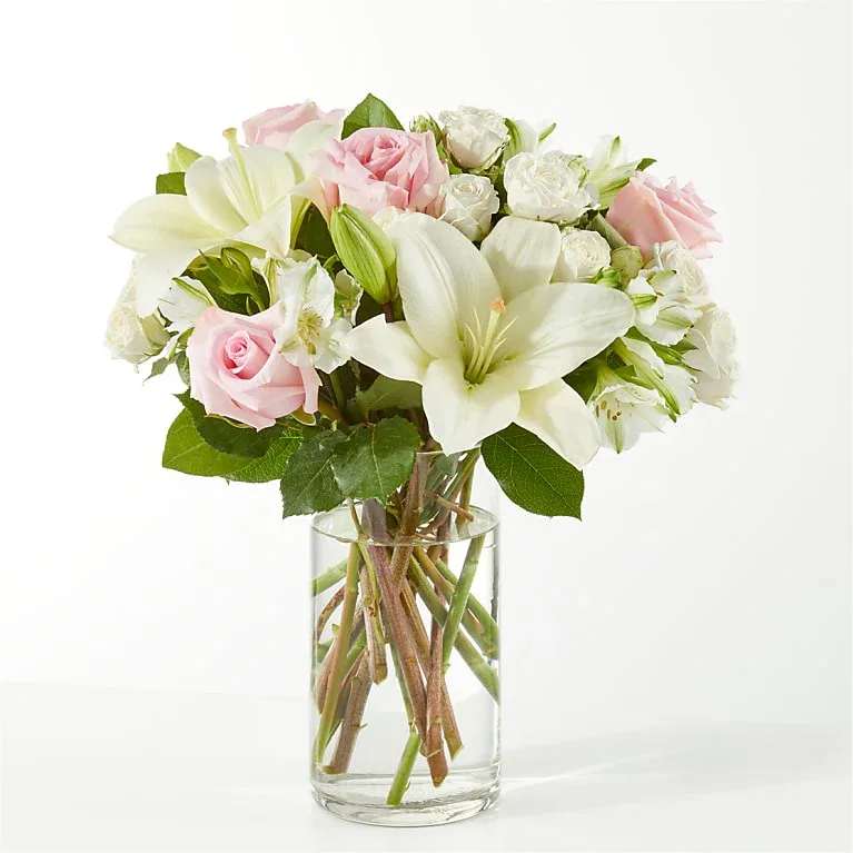 KINDHEARTED BOUQUET KINDHEARTED BOUQUET - The Kindhearted Bouquet is a gentle swirl of pale pink and ivory blooms, the perfect way to share a sweet