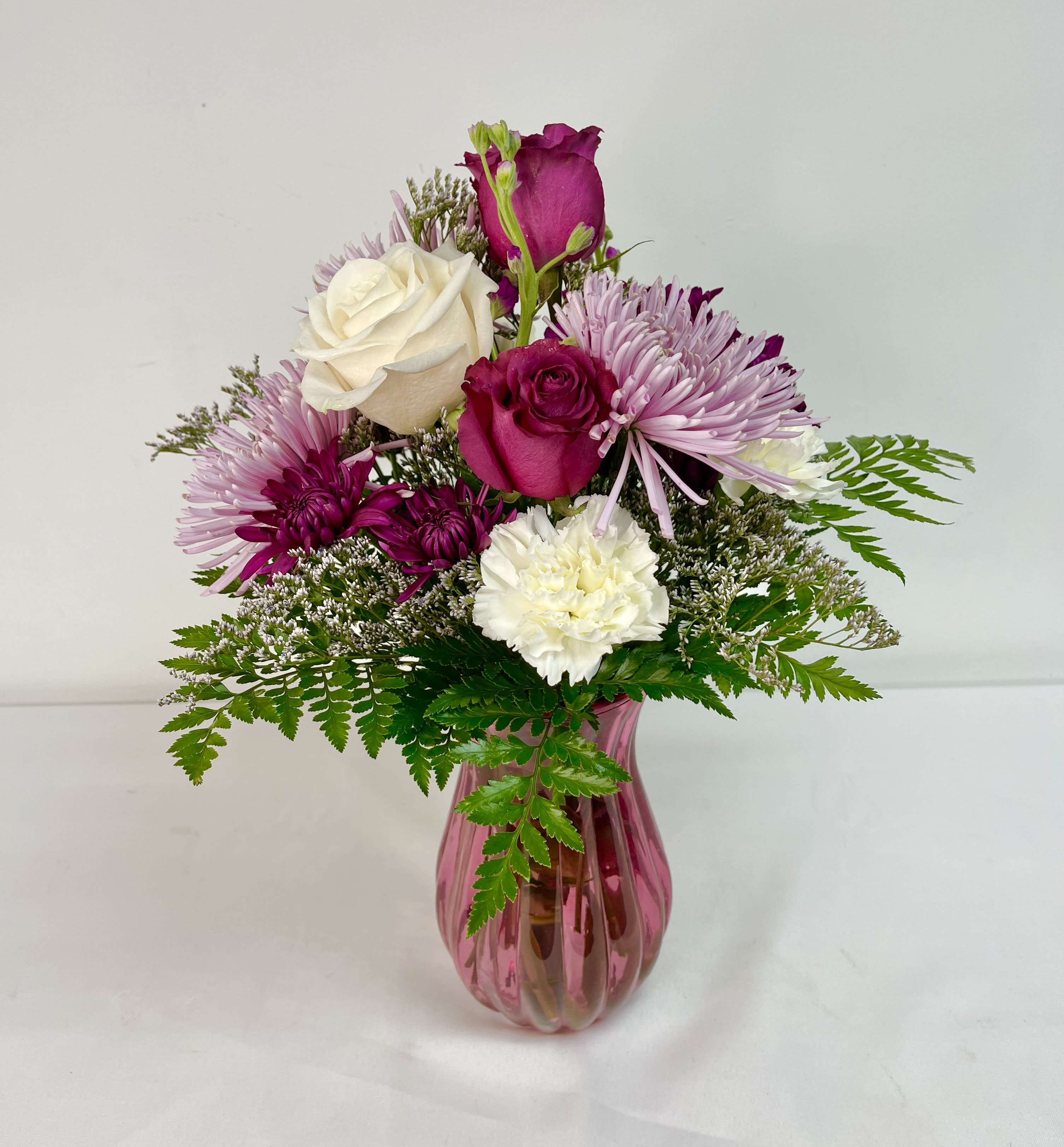 Berry Love - Gorgeous arrangement containing whites and various shades of purple.