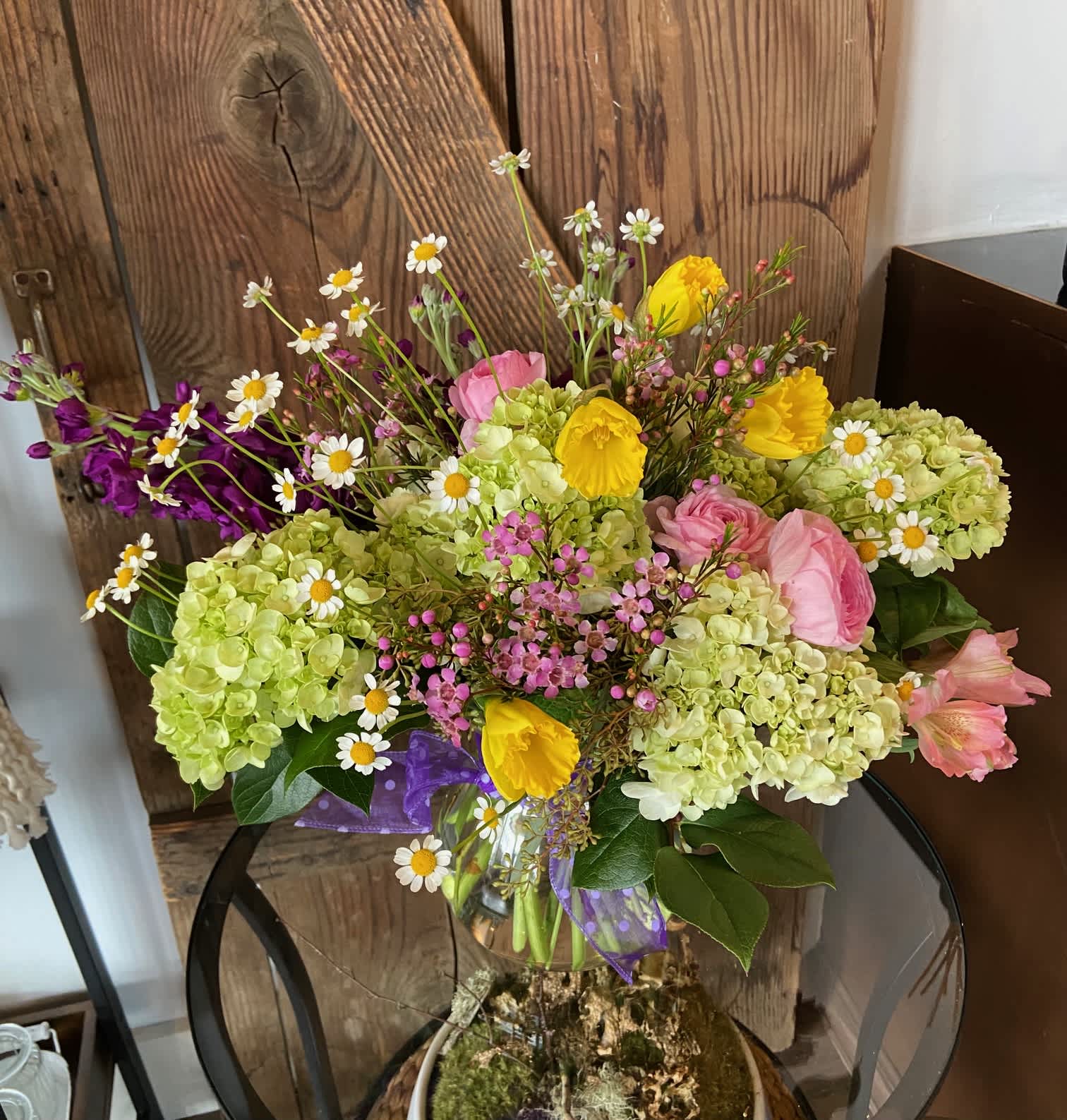Spring Has Sprung Spring Has Sprung - A beautiful assortment of spring time blooms in a classic glass vase. *COLORS AND FLOER VARIETIES MAY VARY