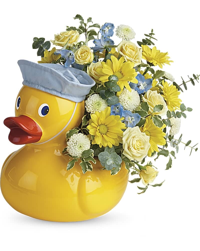 Teleflora's Lucky Ducky Bouquet Teleflora's Lucky Ducky Bouquet - A new baby has joined the flock! Congratulate the lucky parents with this delightfully ducky gift of radiant roses and mums in a sweet ceramic duck keepsake with a matching sailor's cap. This cheerful bouquet includes light yellow spray roses, white button spray chrysanthemums, yellow daisy spray chrysanthemums, light blue delphinium, spiral eucalyptus, pitta negra. Delivered in Teleflora's Just Ducky container. (z)